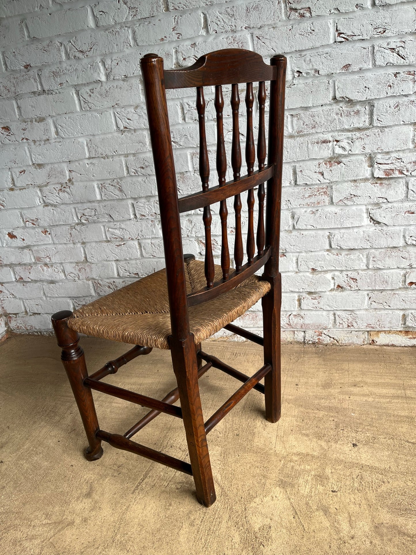 19th century spindle back chair.