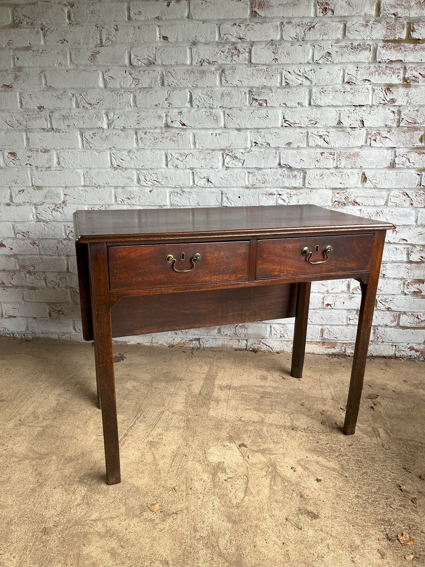 18th century mahogany side or bedroom table with drop leaf.