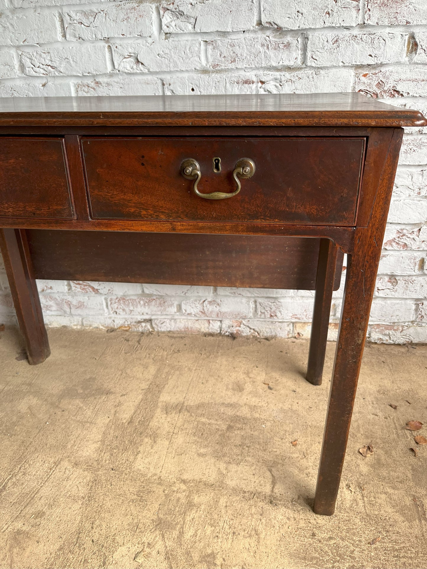 18th century mahogany side or bedroom table with drop leaf.