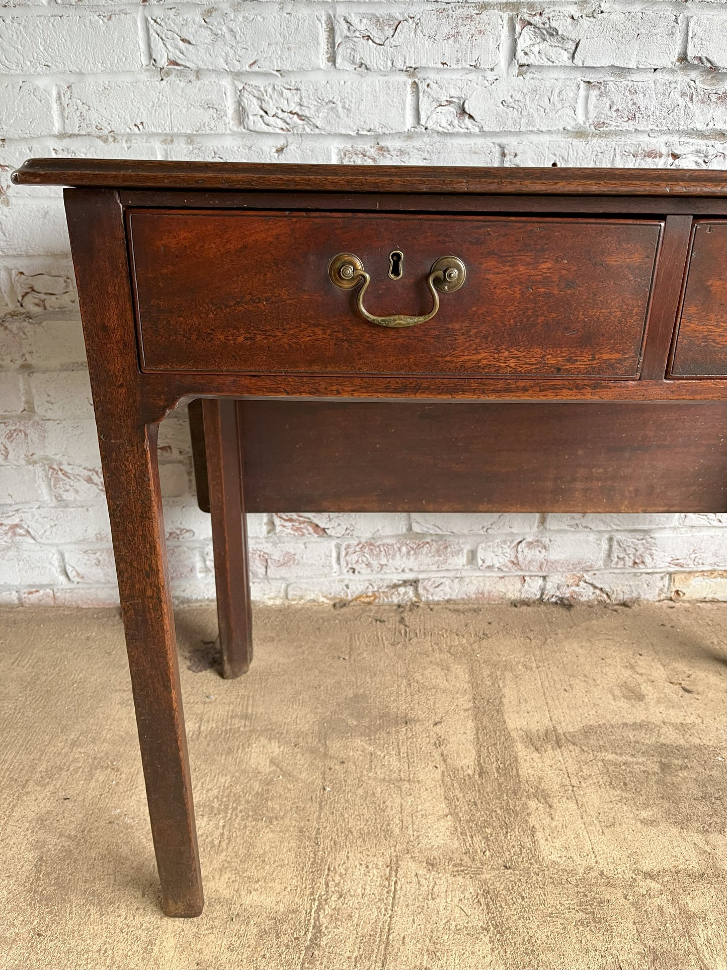 18th century mahogany side or bedroom table with drop leaf.