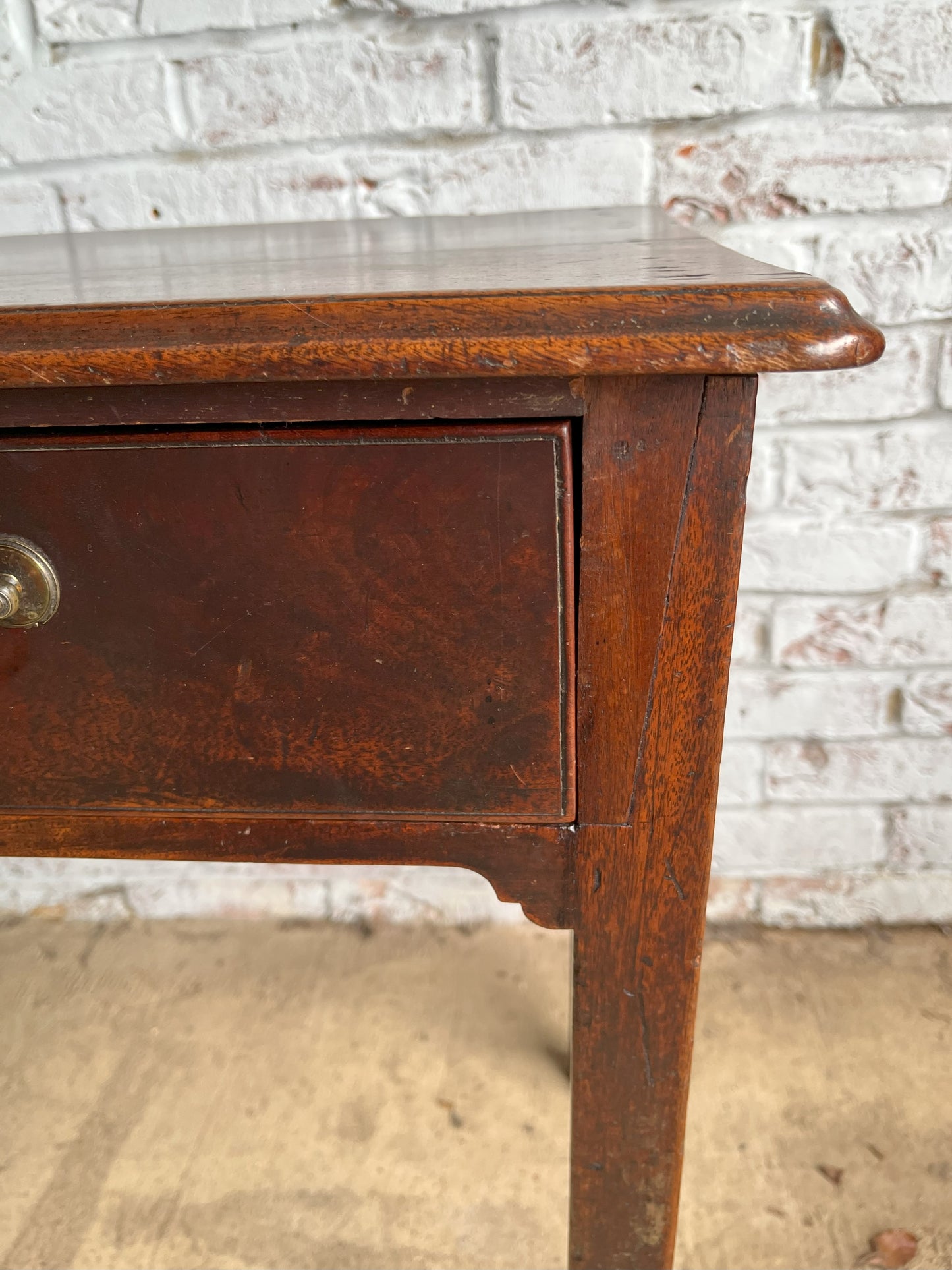 18th century mahogany side or bedroom table with drop leaf.