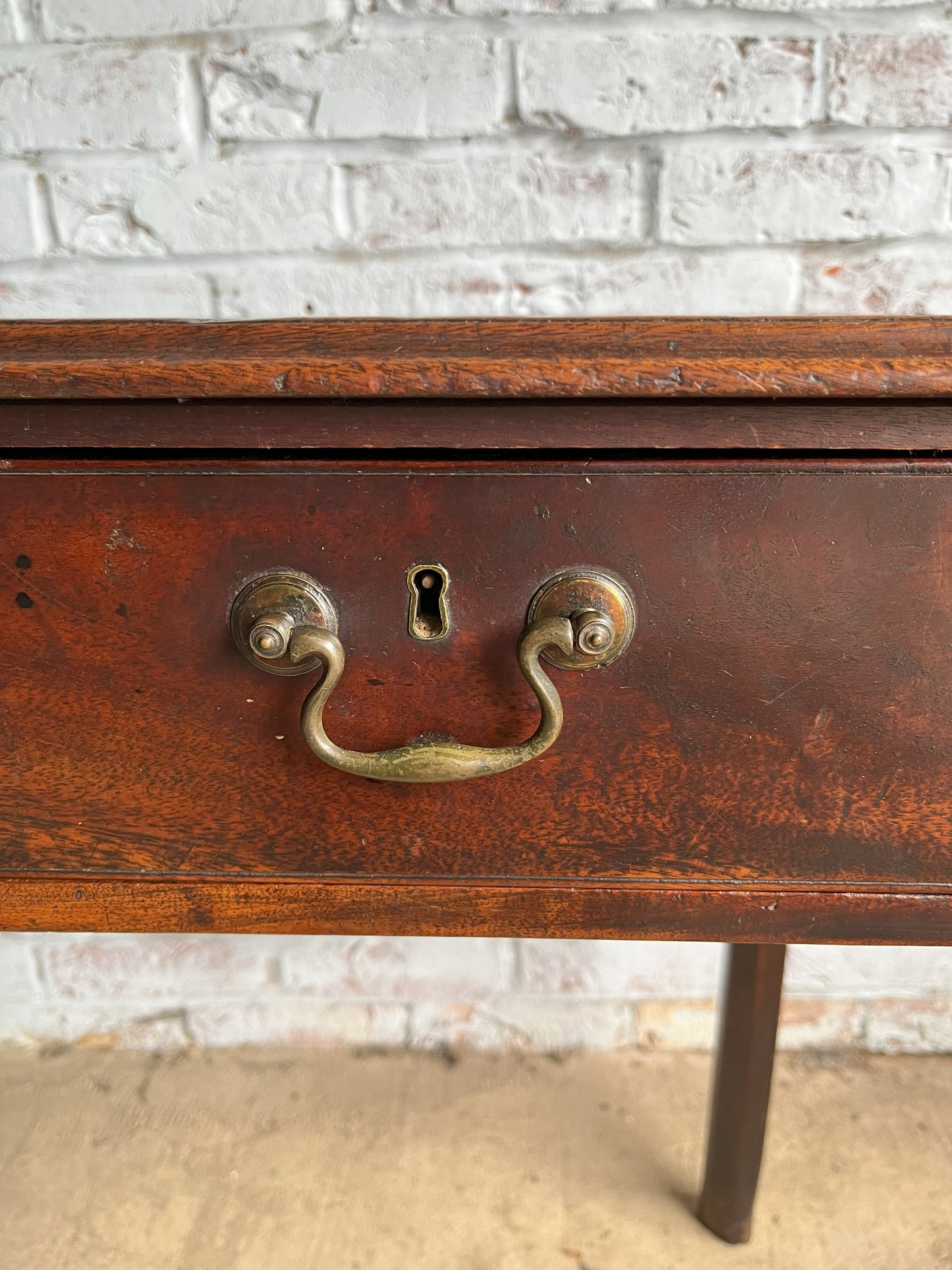 18th century mahogany side or bedroom table with drop leaf.