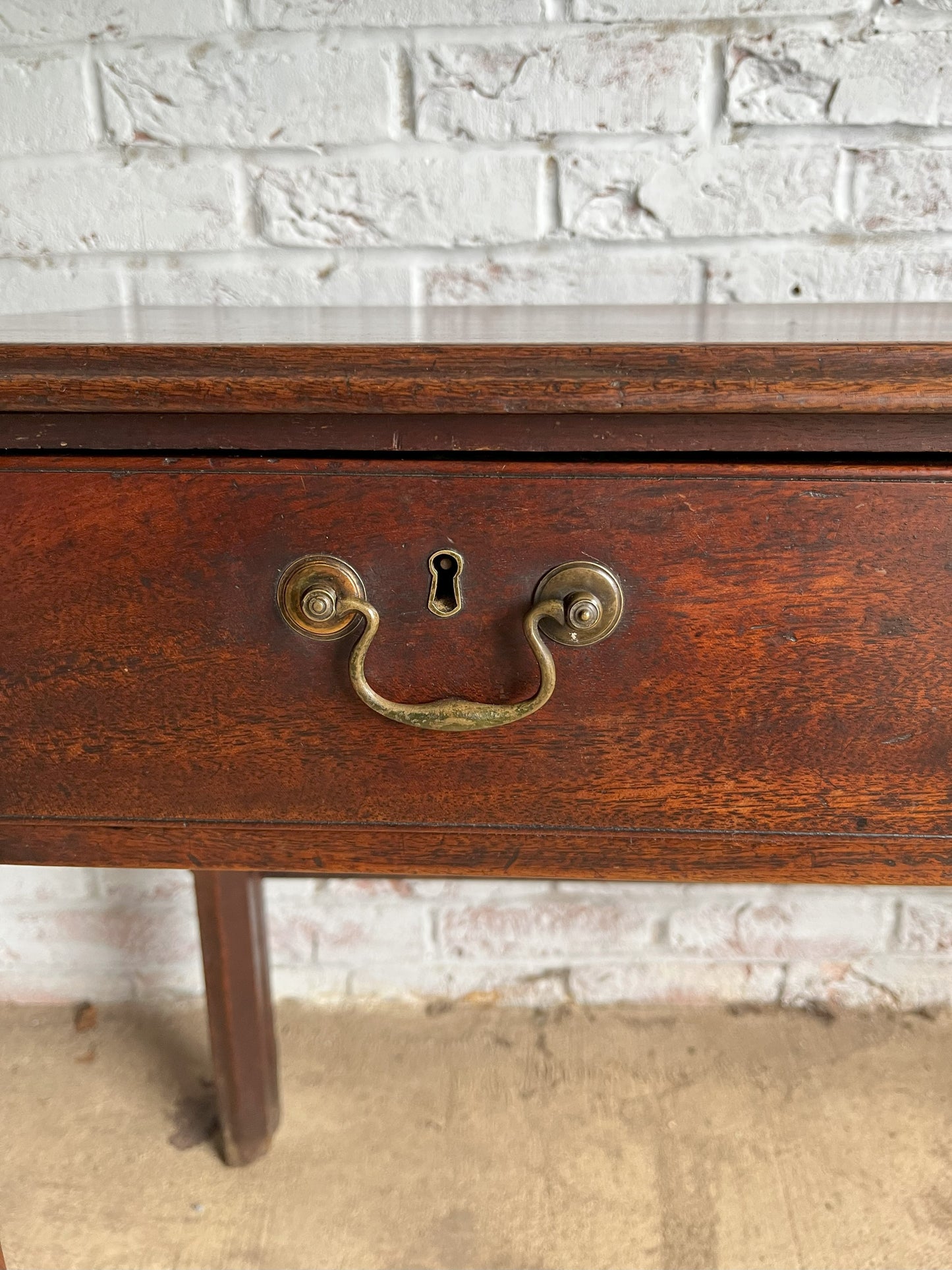 18th century mahogany side or bedroom table with drop leaf.