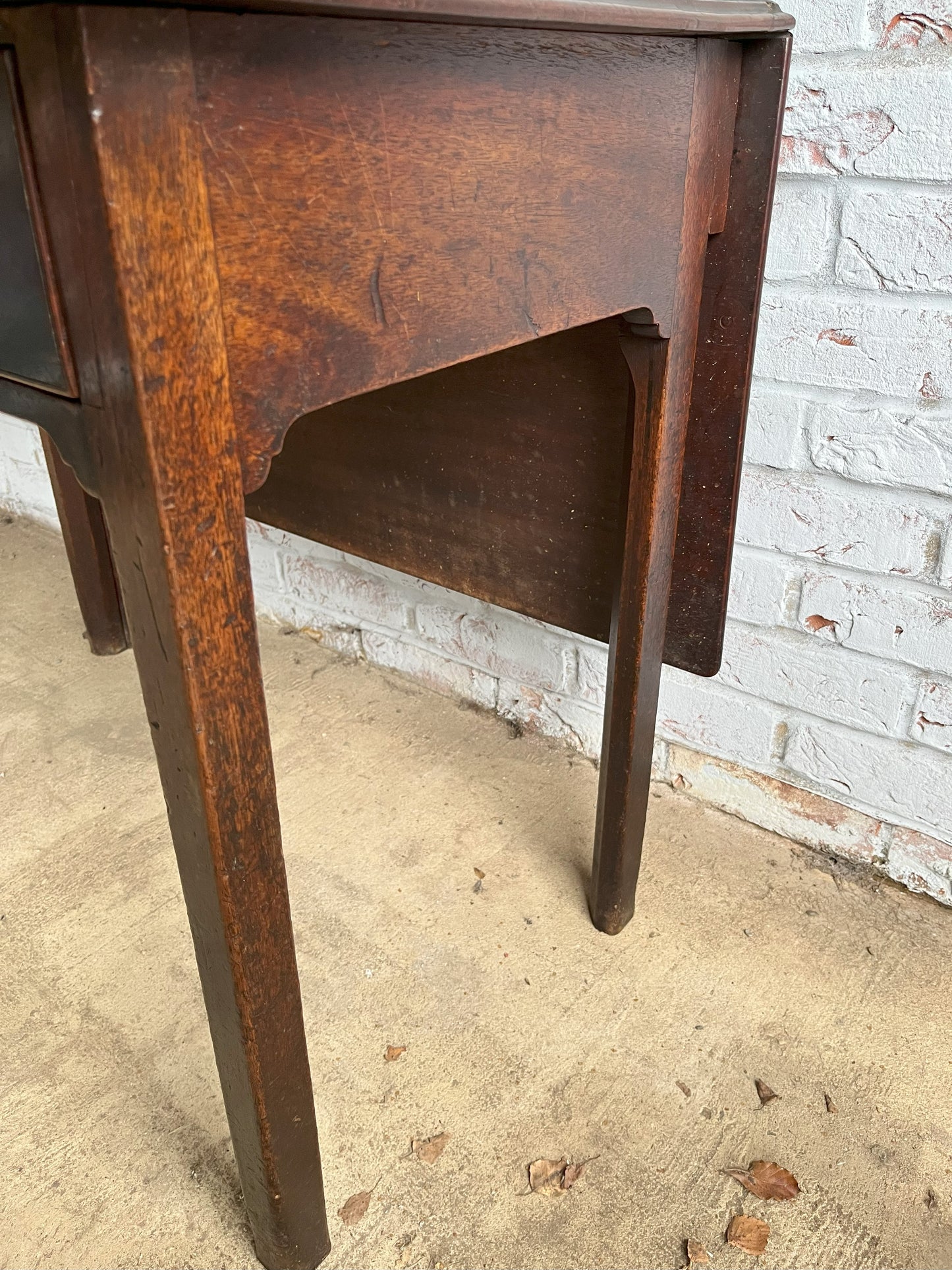 18th century mahogany side or bedroom table with drop leaf.
