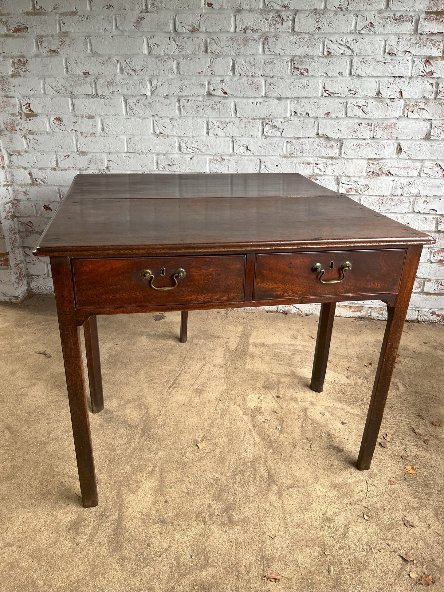 18th century mahogany side or bedroom table with drop leaf.