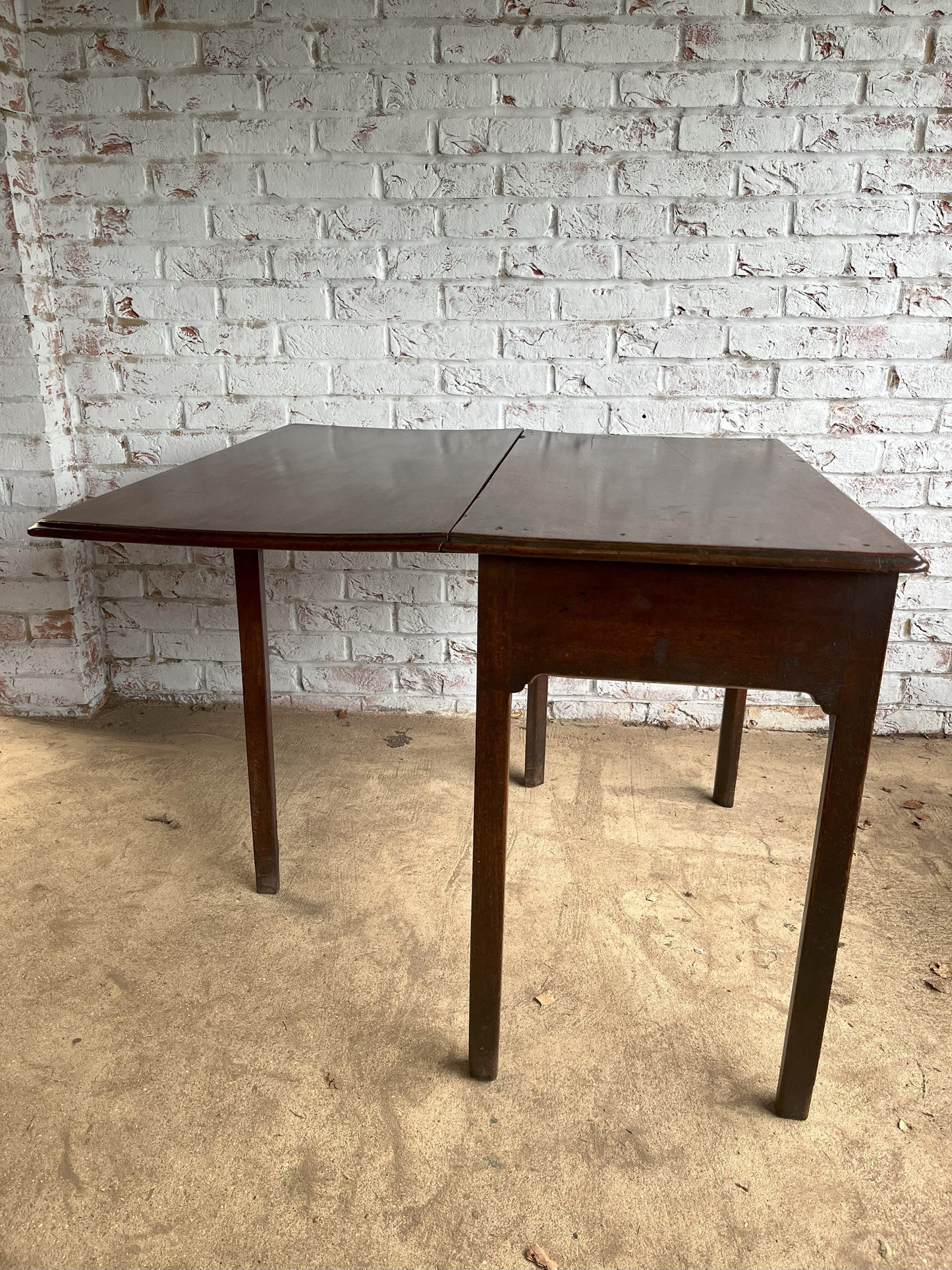 18th century mahogany side or bedroom table with drop leaf.