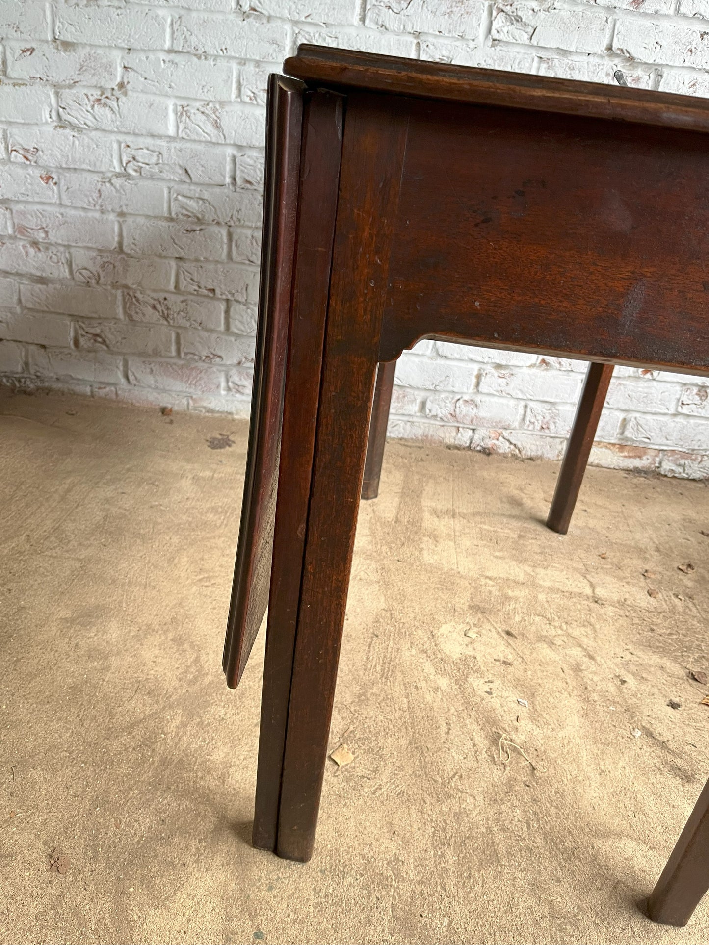 18th century mahogany side or bedroom table with drop leaf.