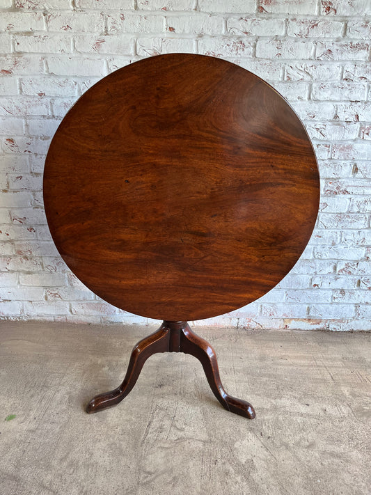 George III mahogany tilt top tripod table.