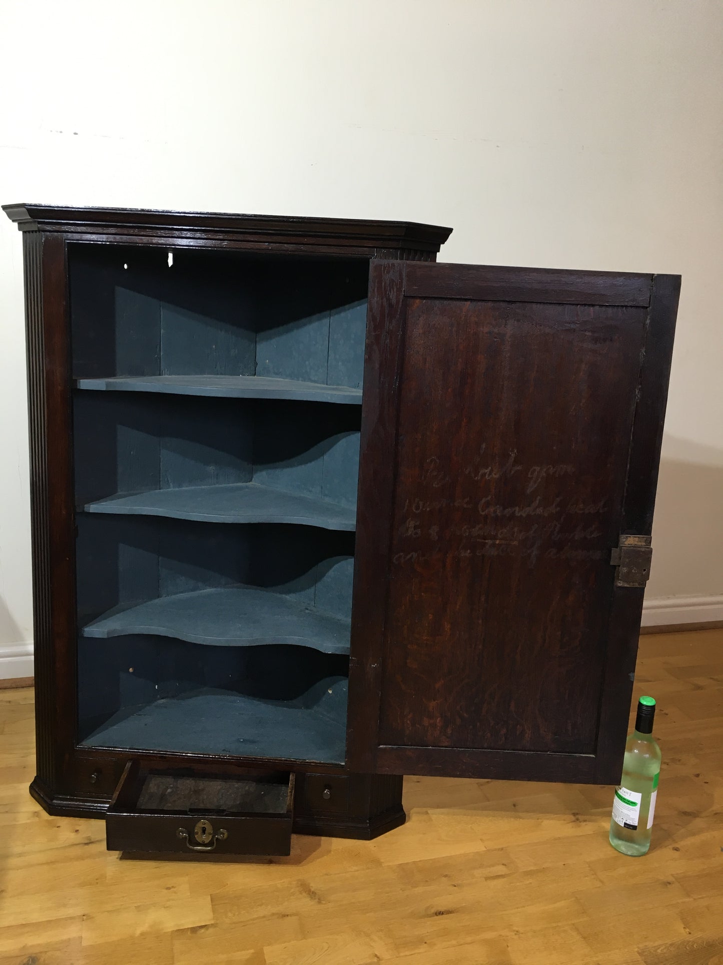 Early 18th century Georgian oak corner cupboard (with spooky writing)