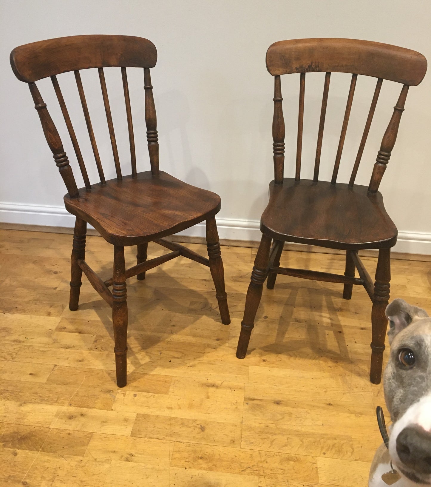 A pair of Victorian spindle-back kitchen chairs.