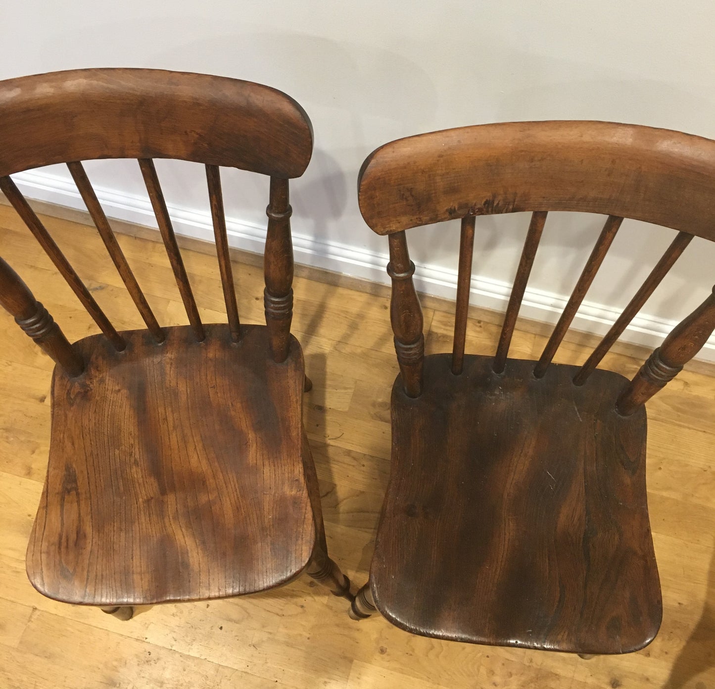 A pair of Victorian spindle-back kitchen chairs.