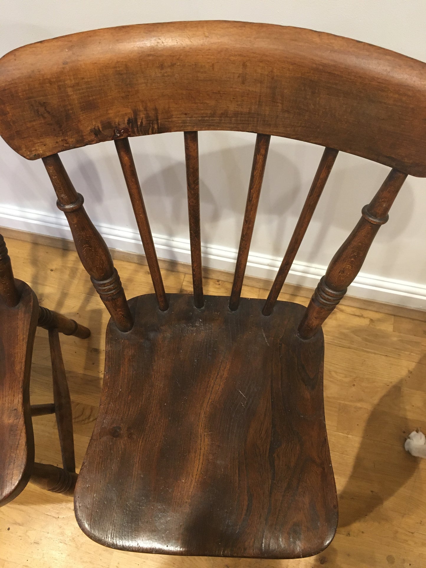 A pair of Victorian spindle-back kitchen chairs.