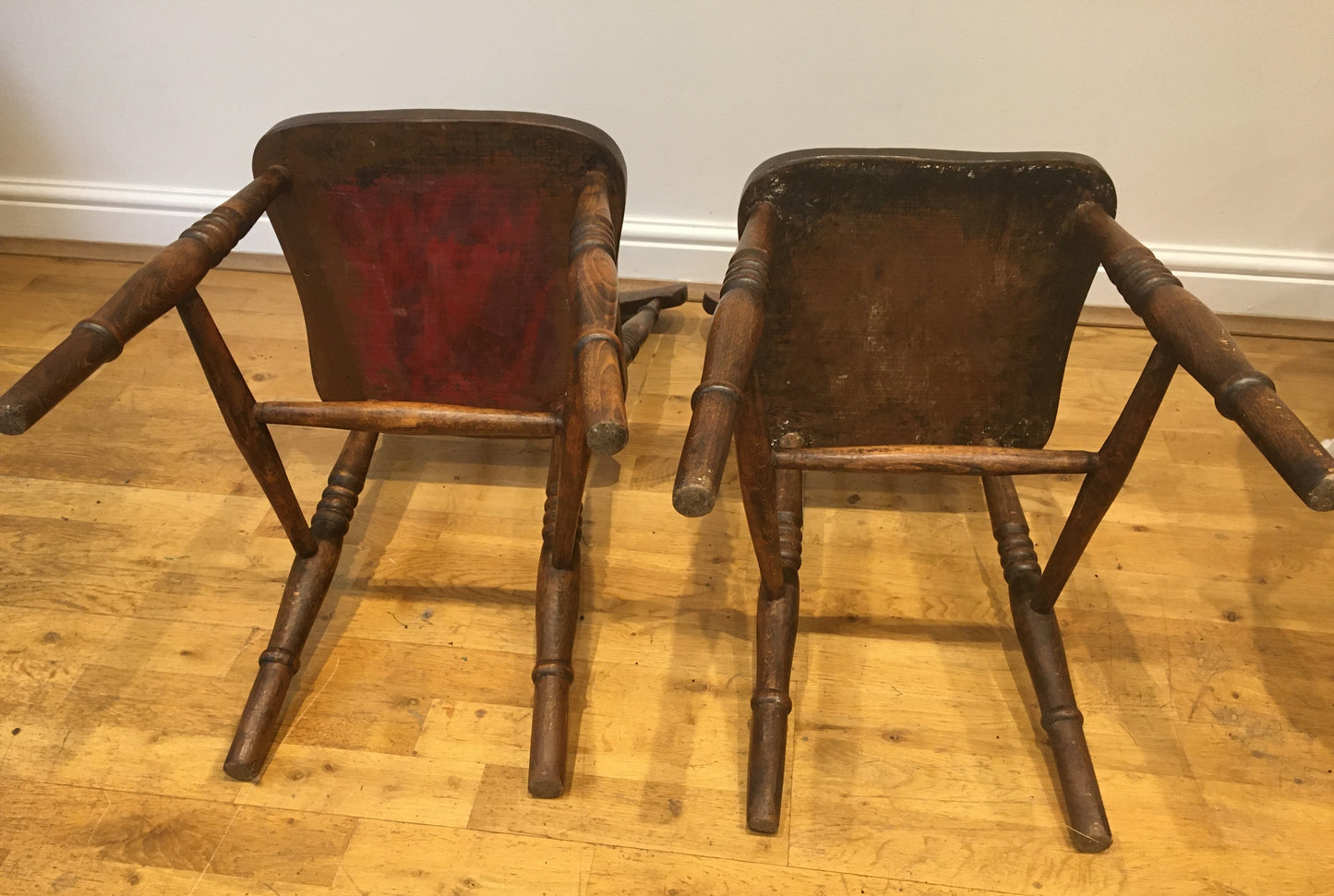 A pair of Victorian spindle-back kitchen chairs.