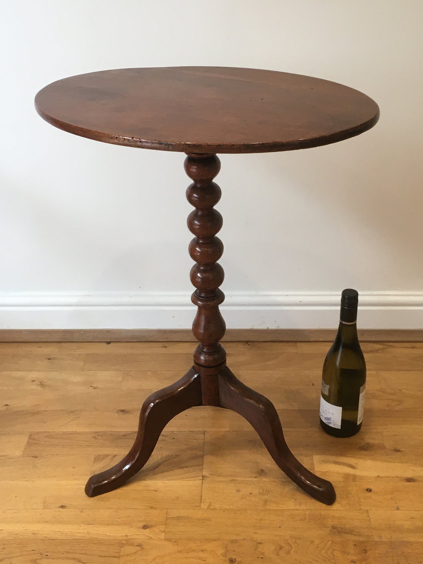 19th century fruitwood tilt-top tripod table on bobbin column