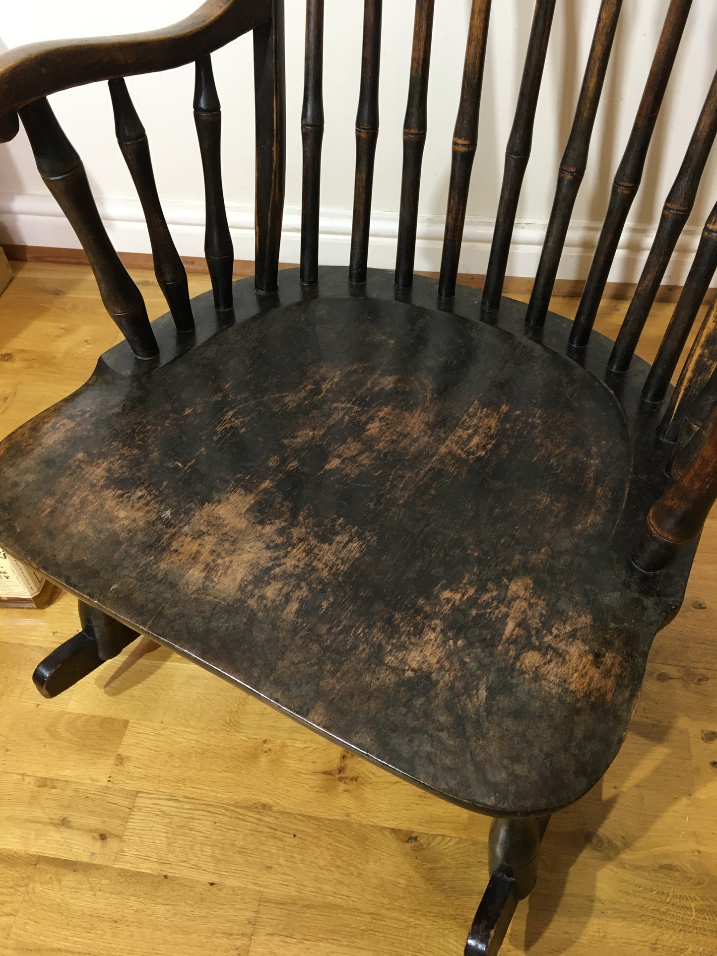 Charming low rocking chair with faux bamboo spindles.