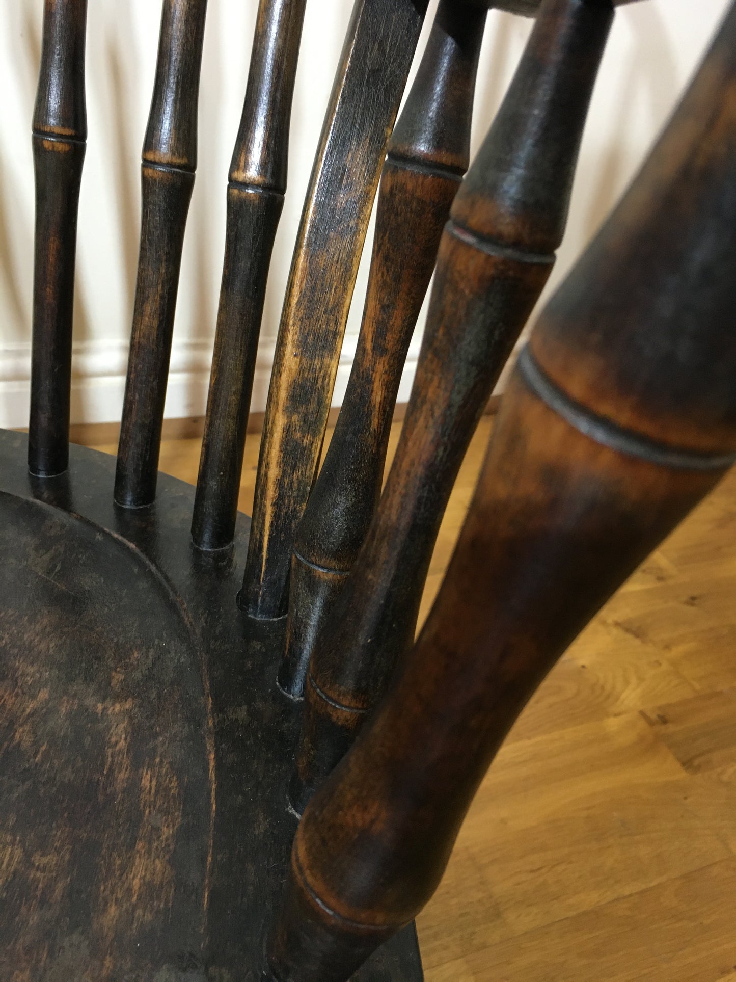 Charming low rocking chair with faux bamboo spindles.