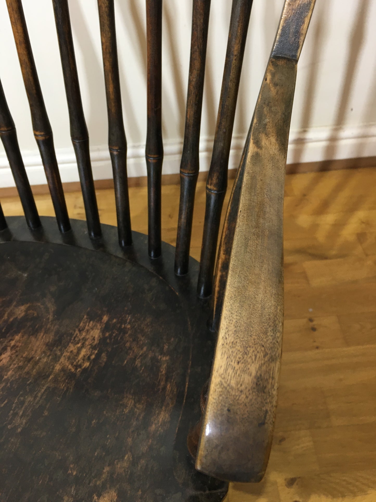 Charming low rocking chair with faux bamboo spindles.