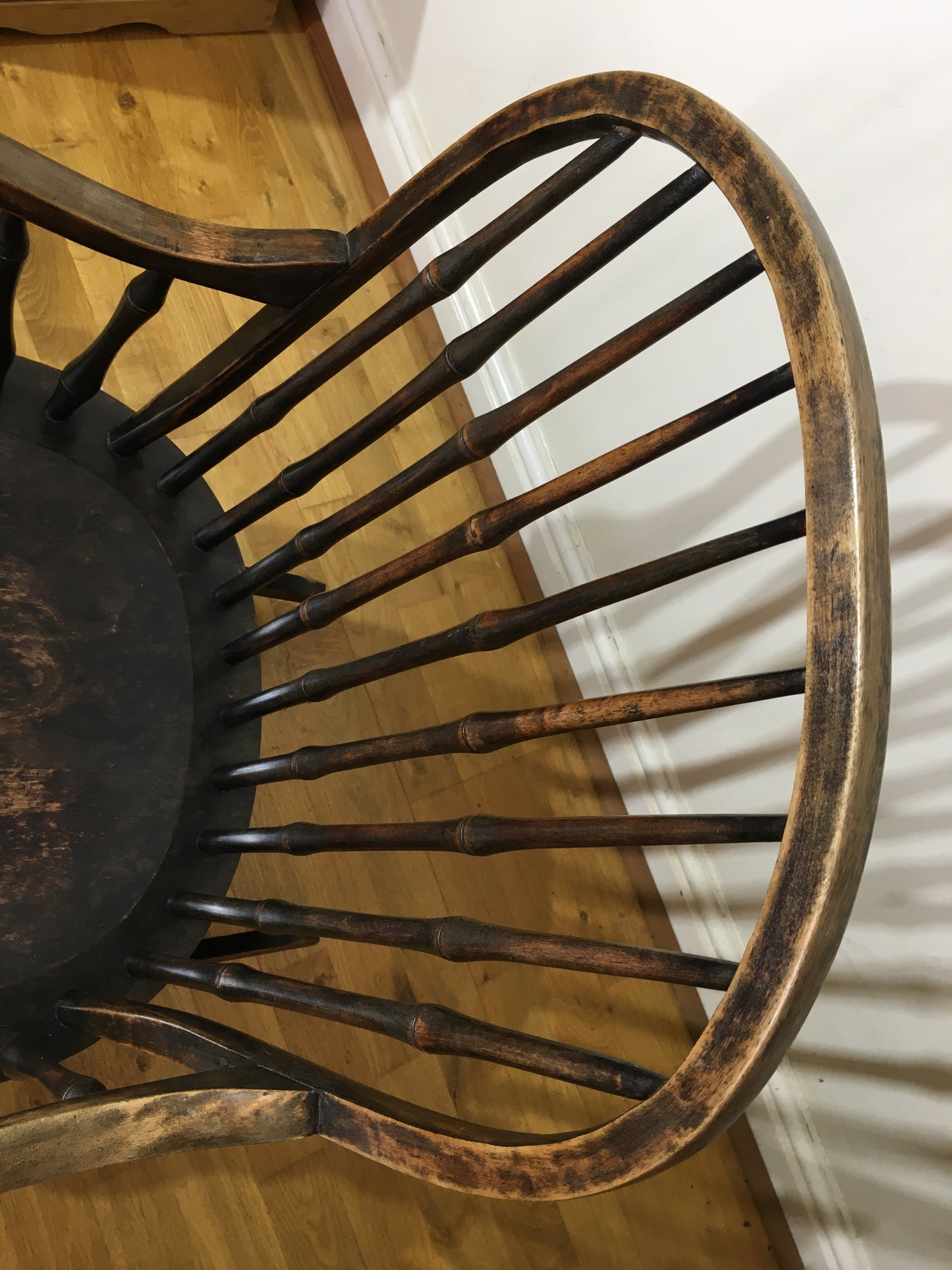 Charming low rocking chair with faux bamboo spindles.