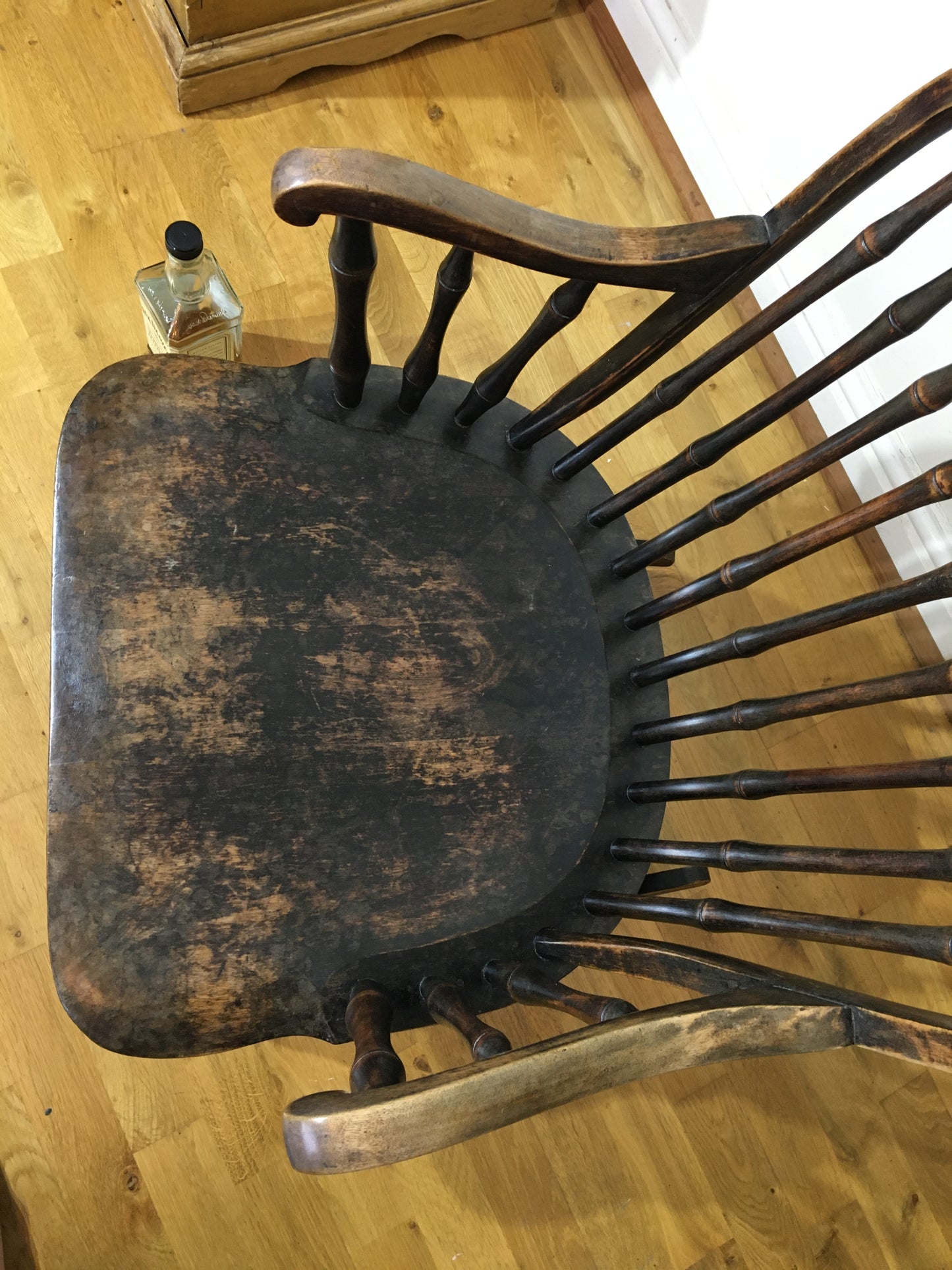 Charming low rocking chair with faux bamboo spindles.