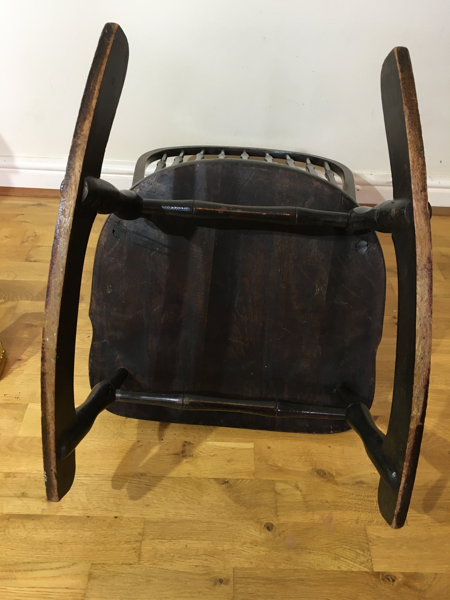 Charming low rocking chair with faux bamboo spindles.
