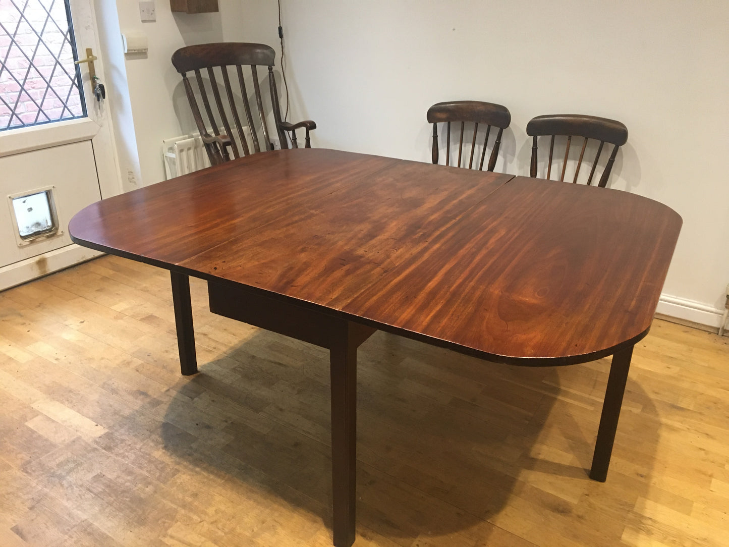A fine, large George III mahogany drop-leaf dining table, with excellent provenance.