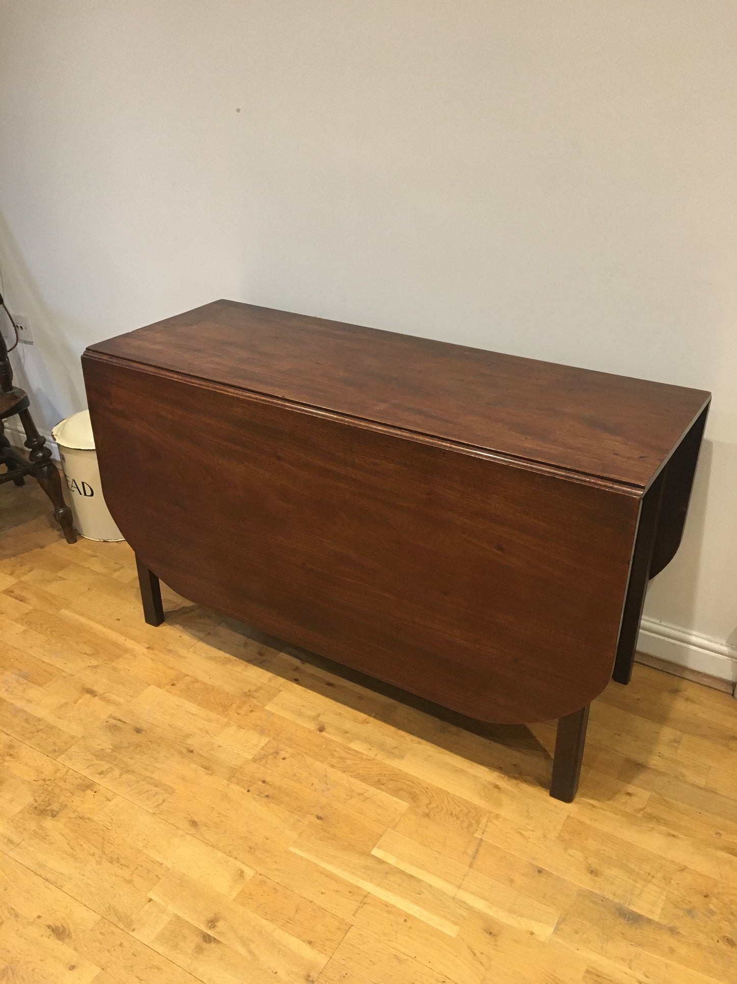 A fine, large George III mahogany drop-leaf dining table, with excellent provenance.