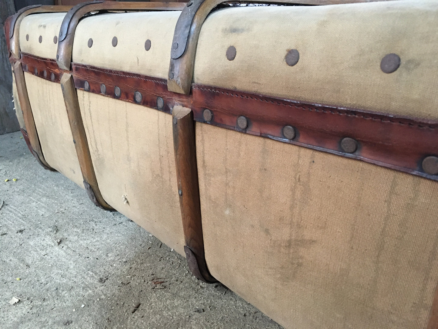 Untouched vintage steamer travel trunk with labels.