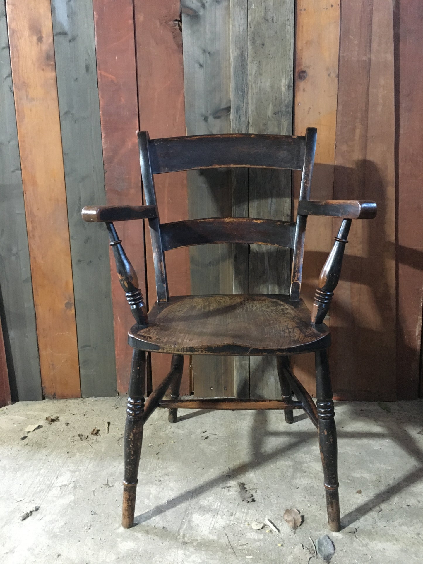 Late 19th century black-painted antique farmhouse kitchen chair.