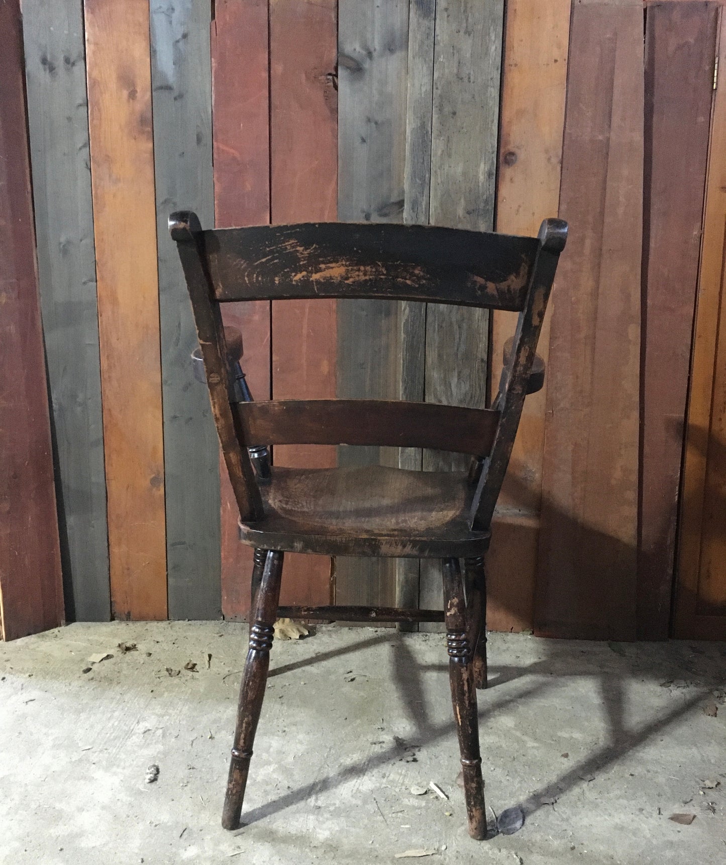 Late 19th century black-painted antique farmhouse kitchen chair.