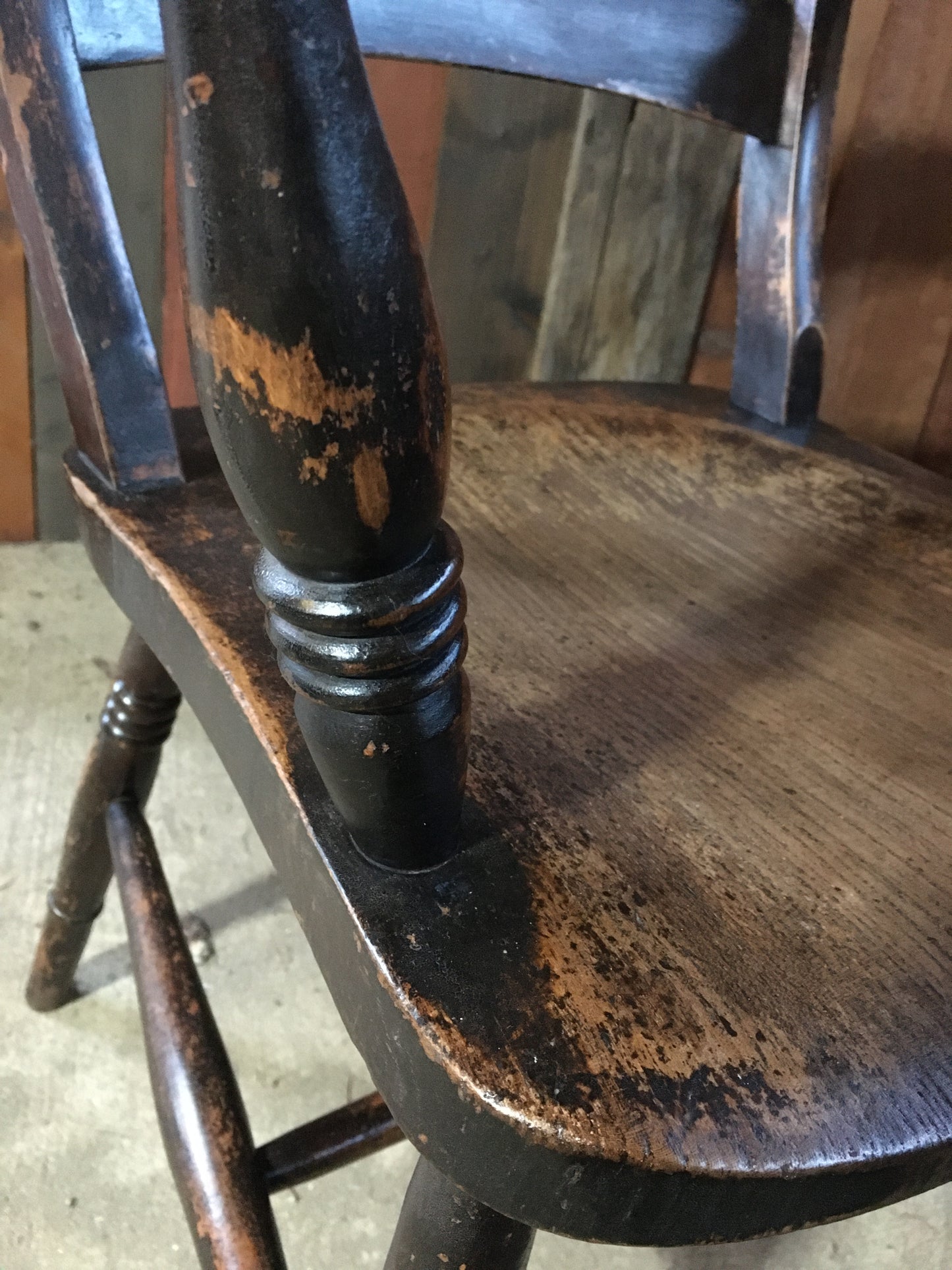 Late 19th century black-painted antique farmhouse kitchen chair.