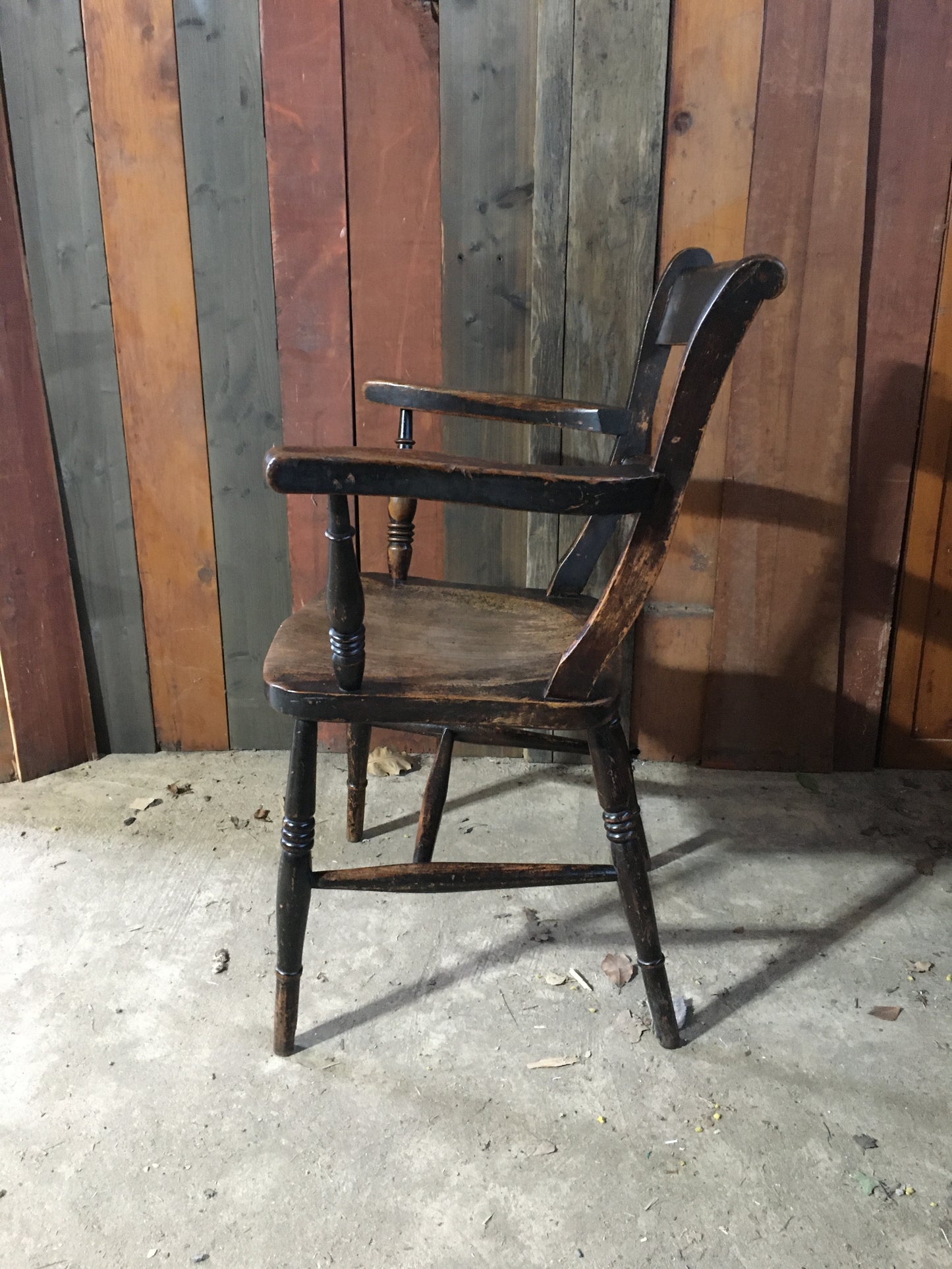 Late 19th century black-painted antique farmhouse kitchen chair.