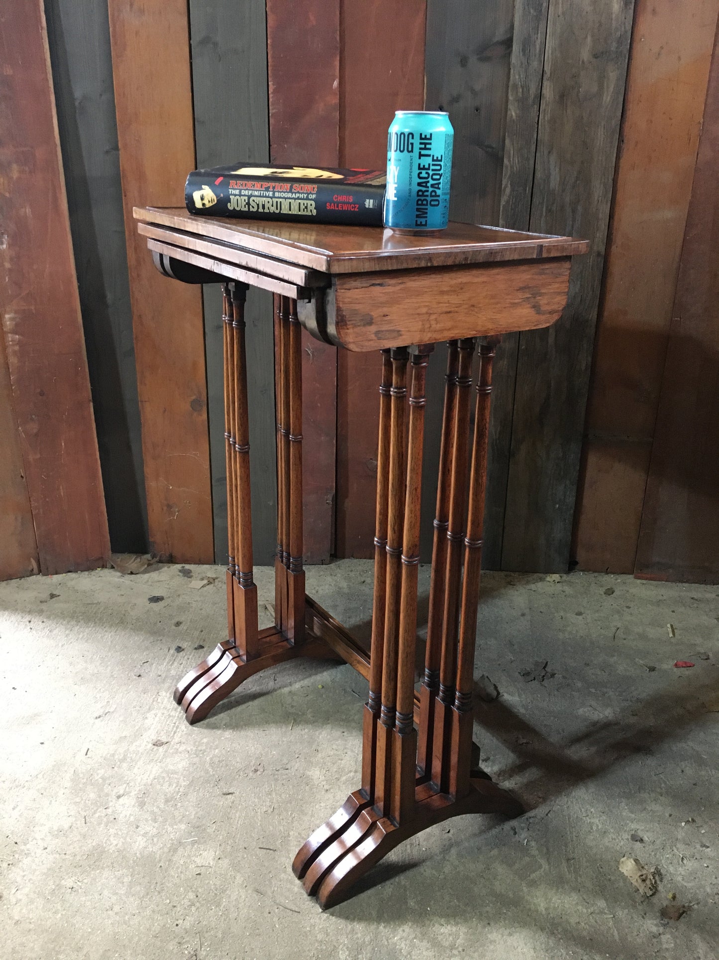 A nest of three late Regency rosewood tables.