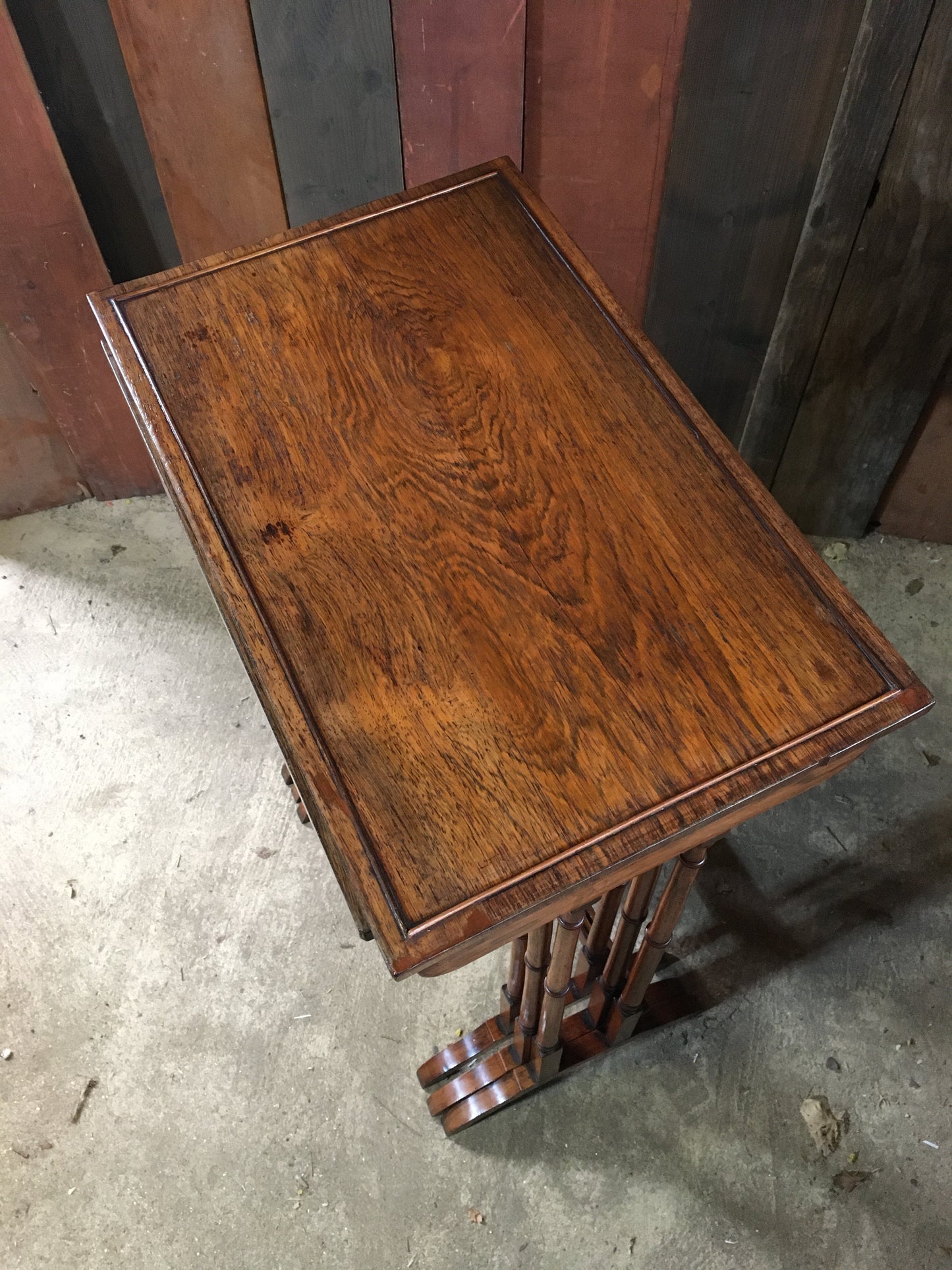 A nest of three late Regency rosewood tables.