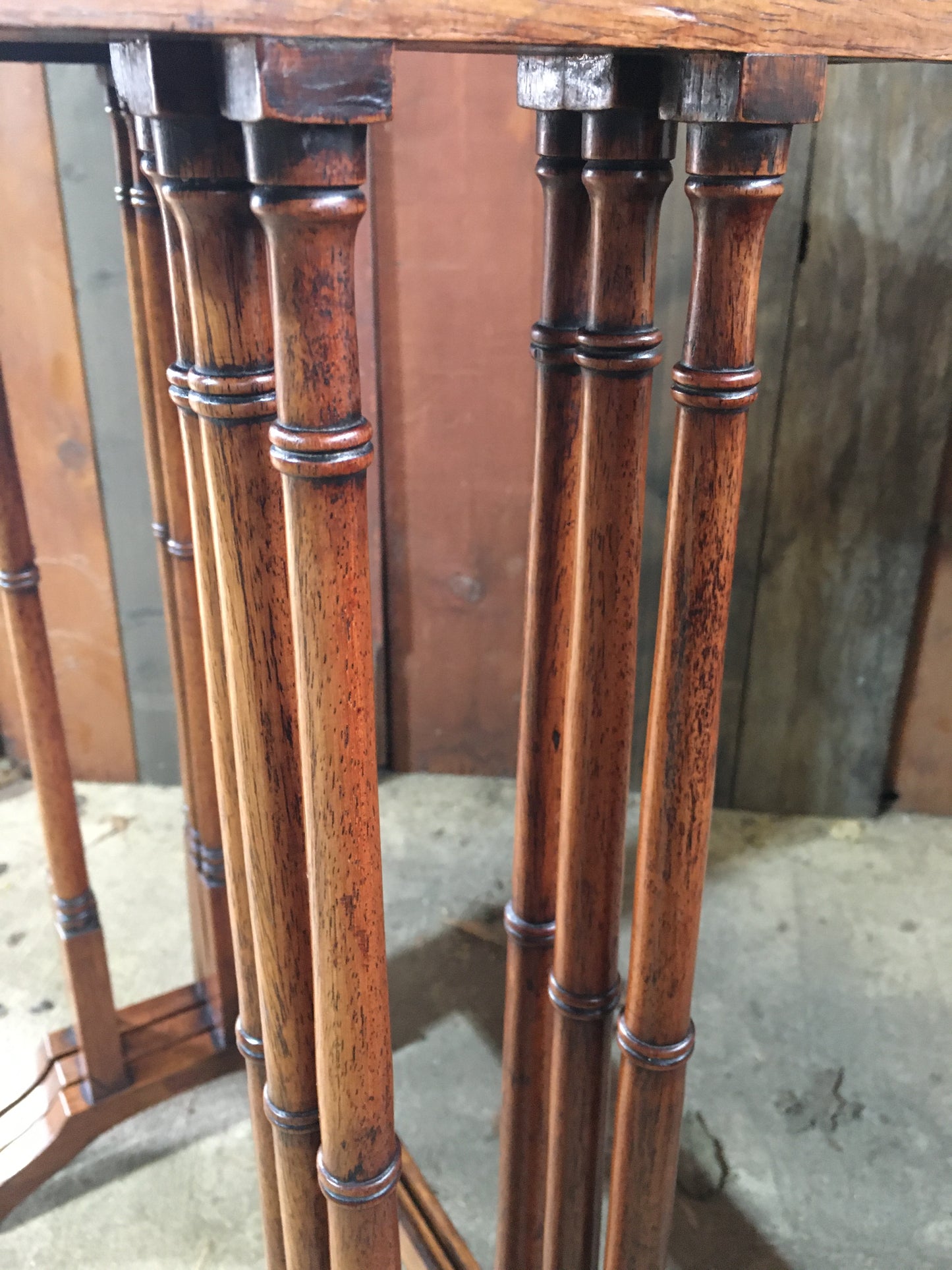 A nest of three late Regency rosewood tables.