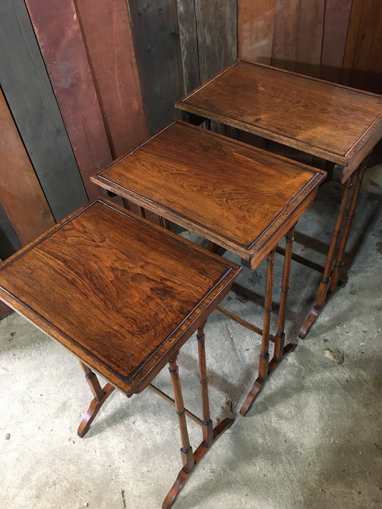A nest of three late Regency rosewood tables.