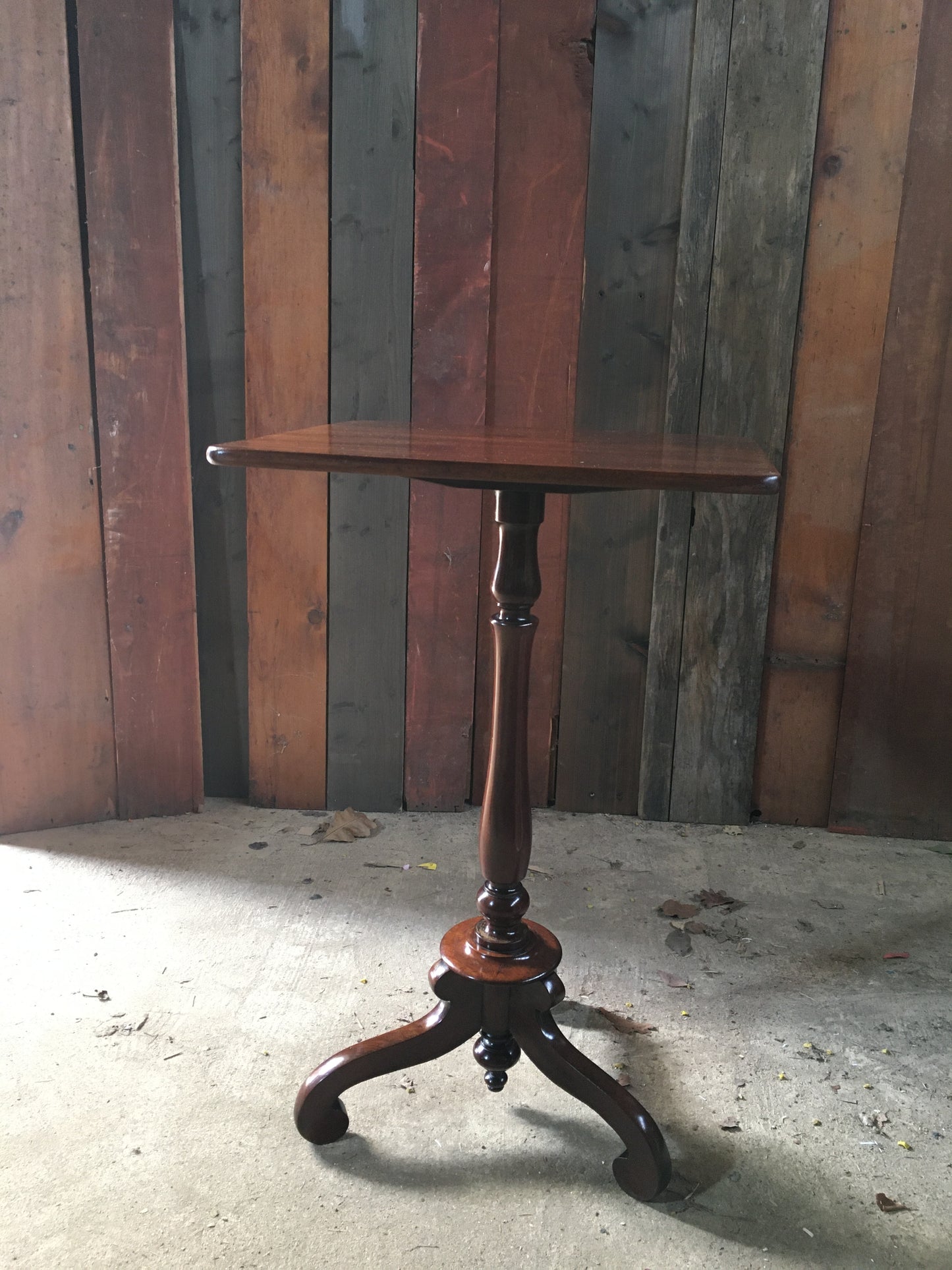 Elegant mahogany wine or tripod table.