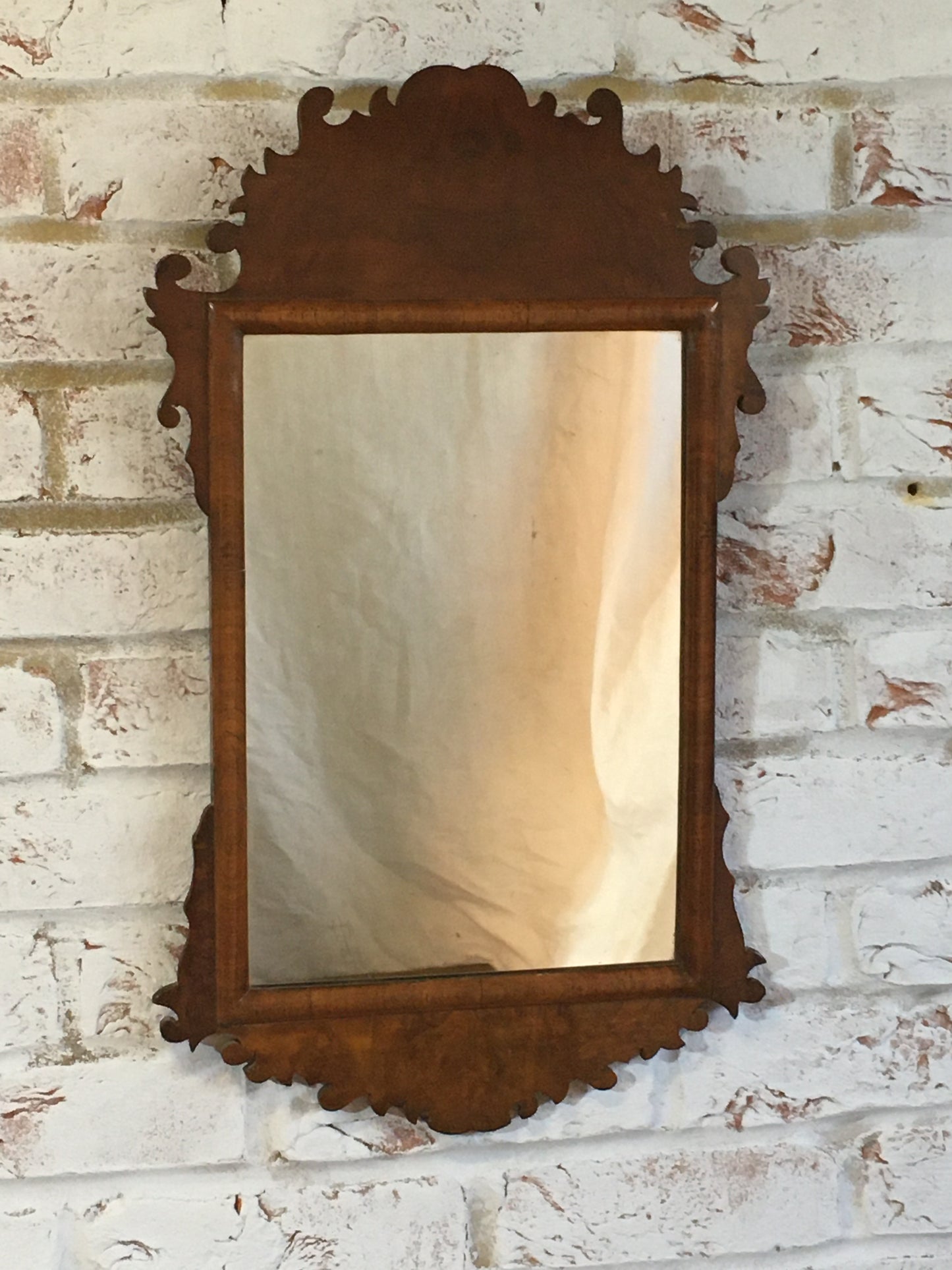 Georgian style walnut fret cut wall mirror.