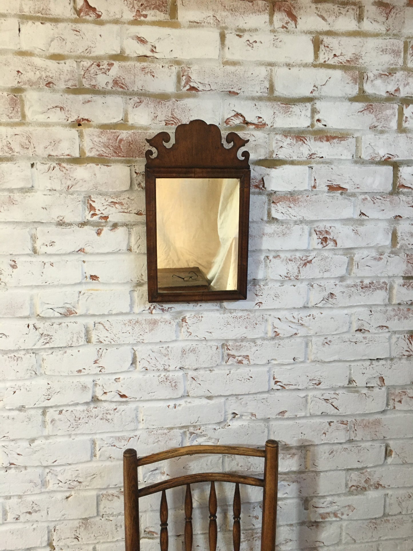 Small Georgian walnut fret cut wall mirror.