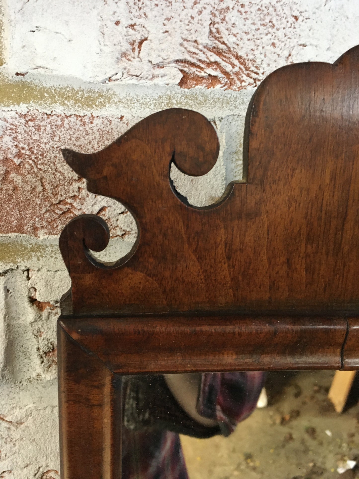 Small Georgian walnut fret cut wall mirror.