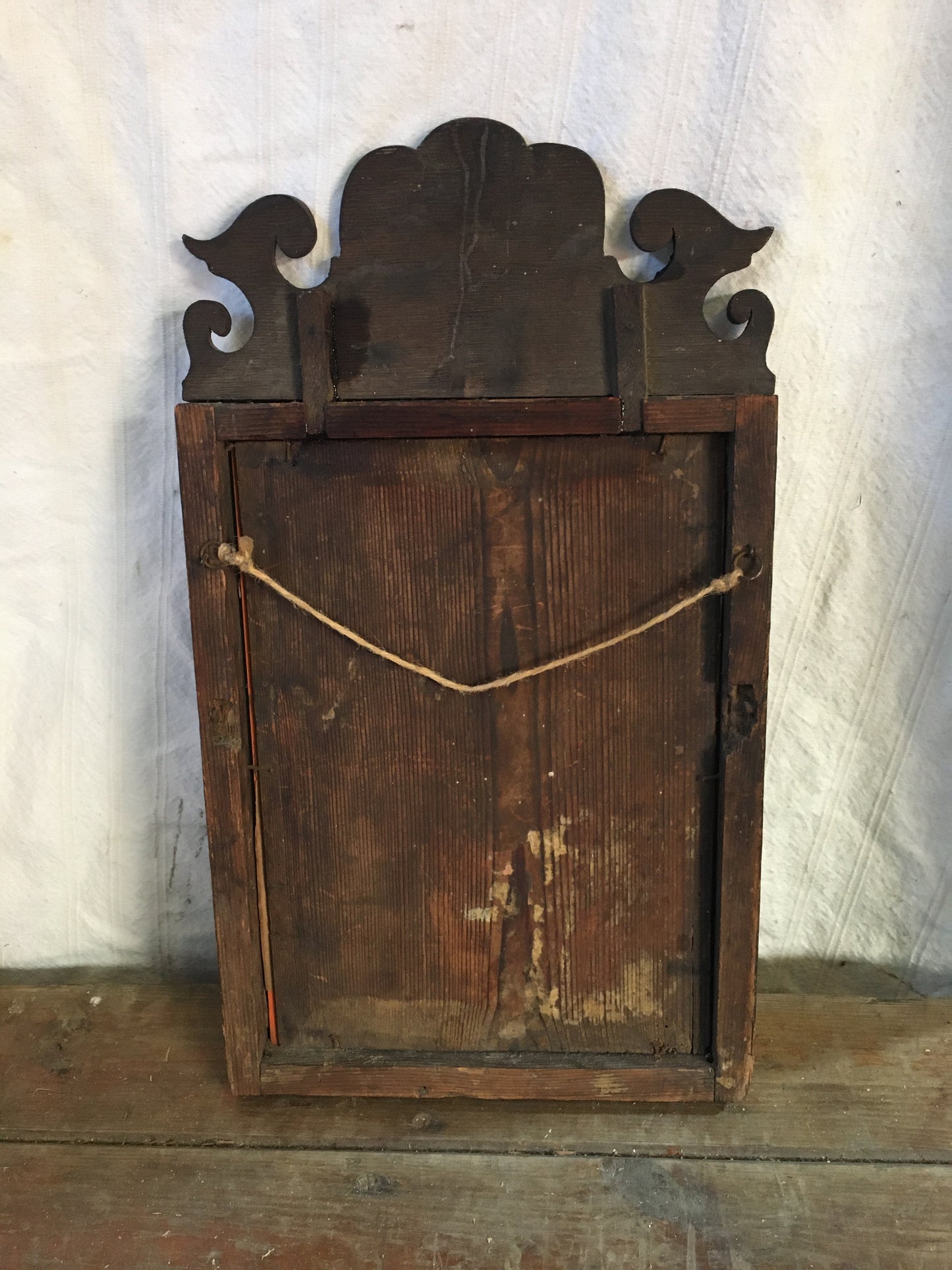 Small Georgian walnut fret cut wall mirror.