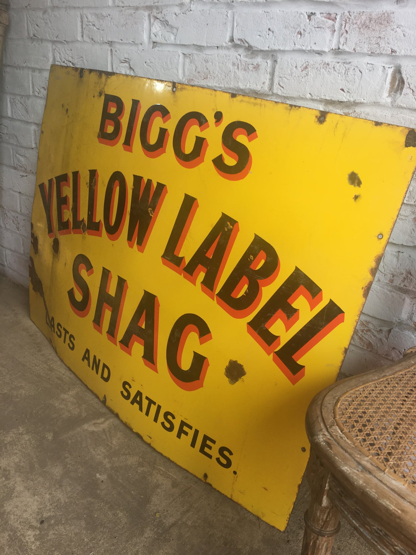 Large vintage enamel sign for "Bigg's Yellow Label Shag".