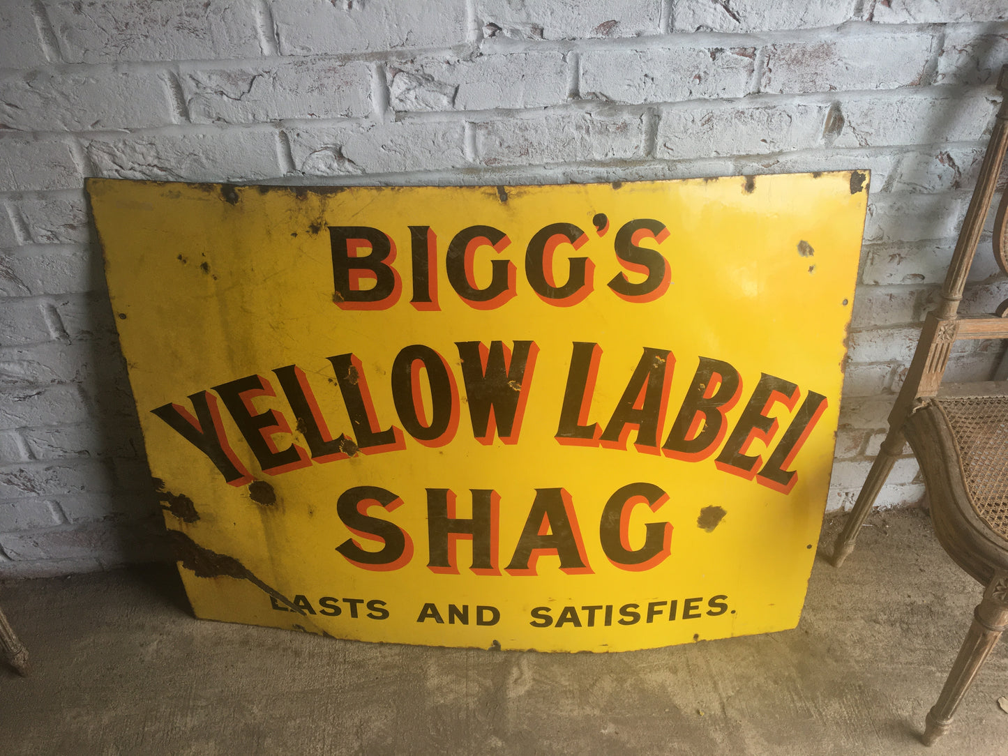 Large vintage enamel sign for "Bigg's Yellow Label Shag".