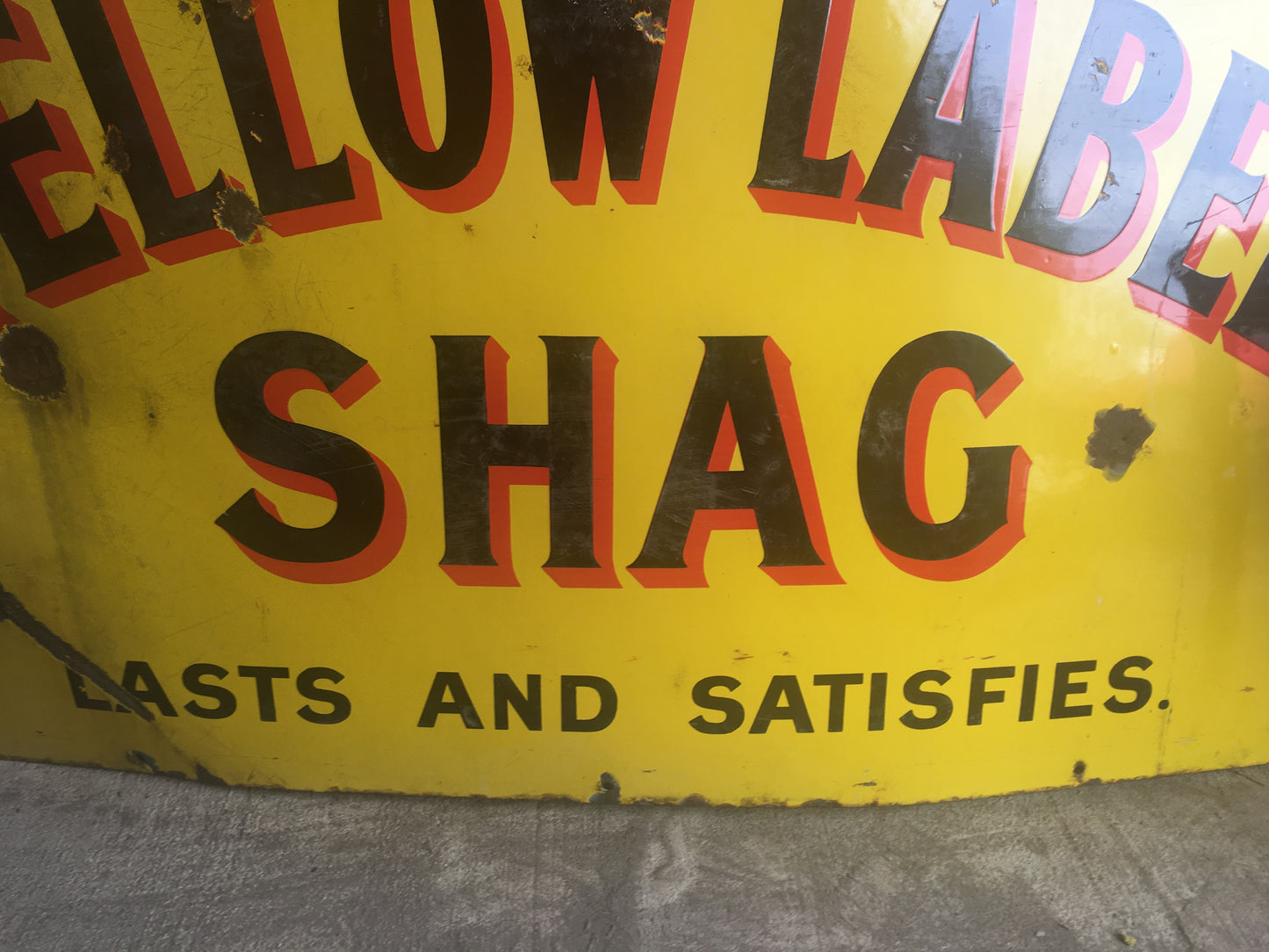 Large vintage enamel sign for "Bigg's Yellow Label Shag".