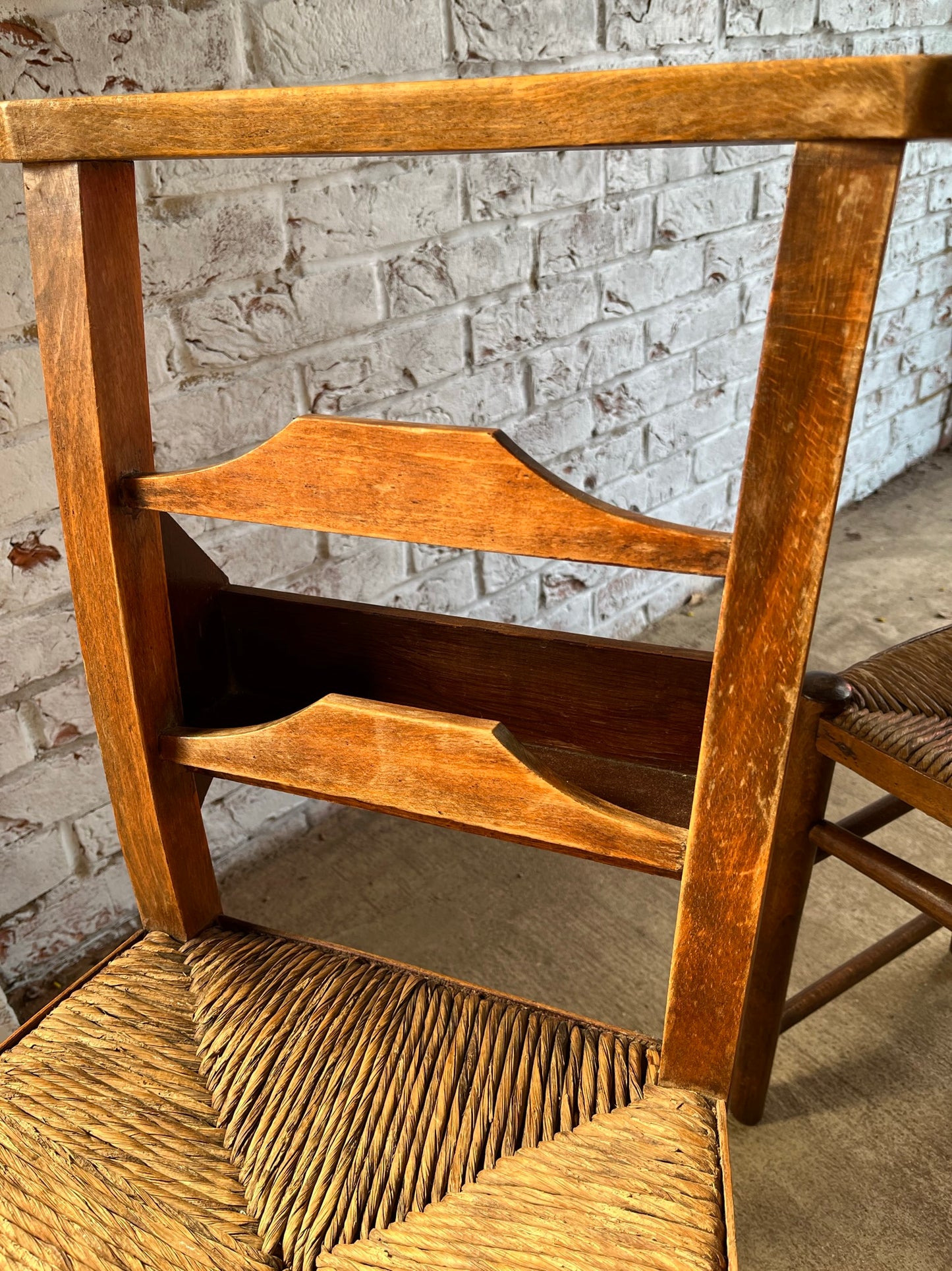 Set of four rustic early 20th century ladder back chapel chairs.