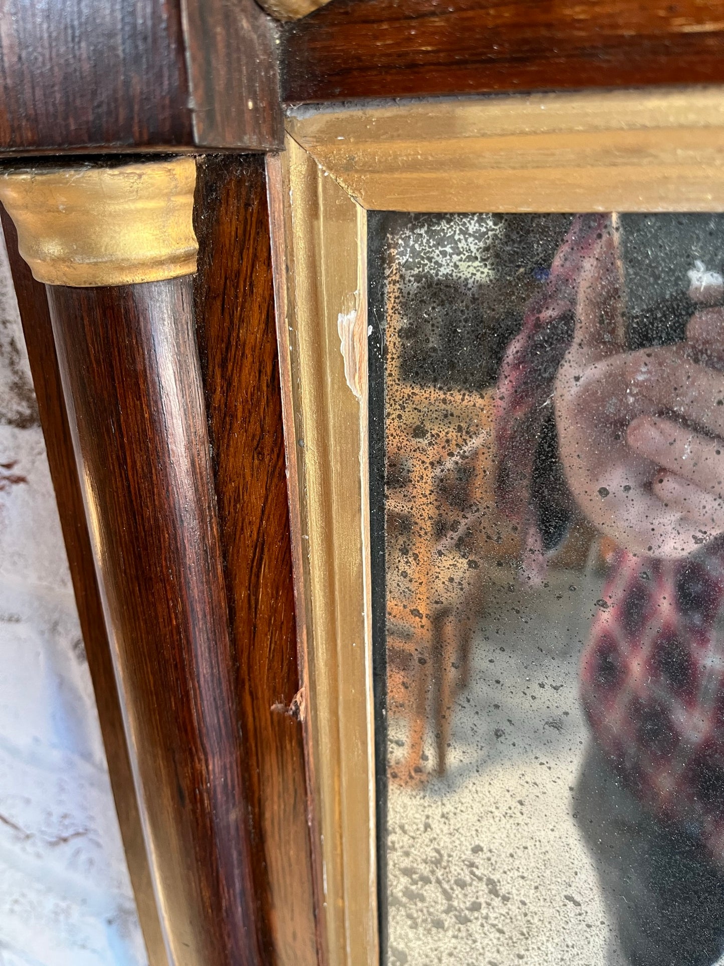 Regency rosewood and gilt overmantel or wall mirror with original foxed plate.