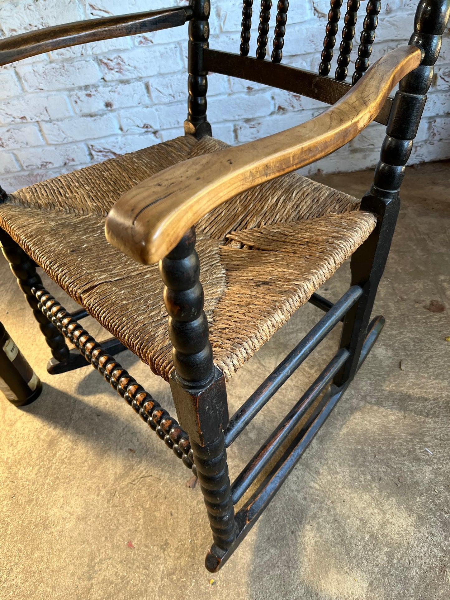 Arts and Crafts bobbin-turned rocking chair, in the style of Ernest Gimson, circa 1900-1910.