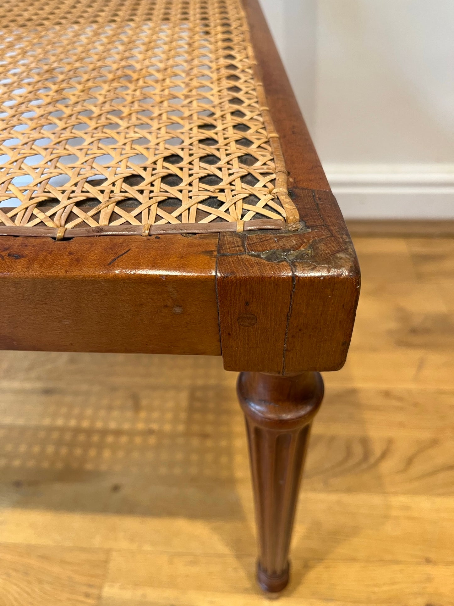 Fine cane-seated chair from Brudenell House, Bucks, in the manner of Gillows.