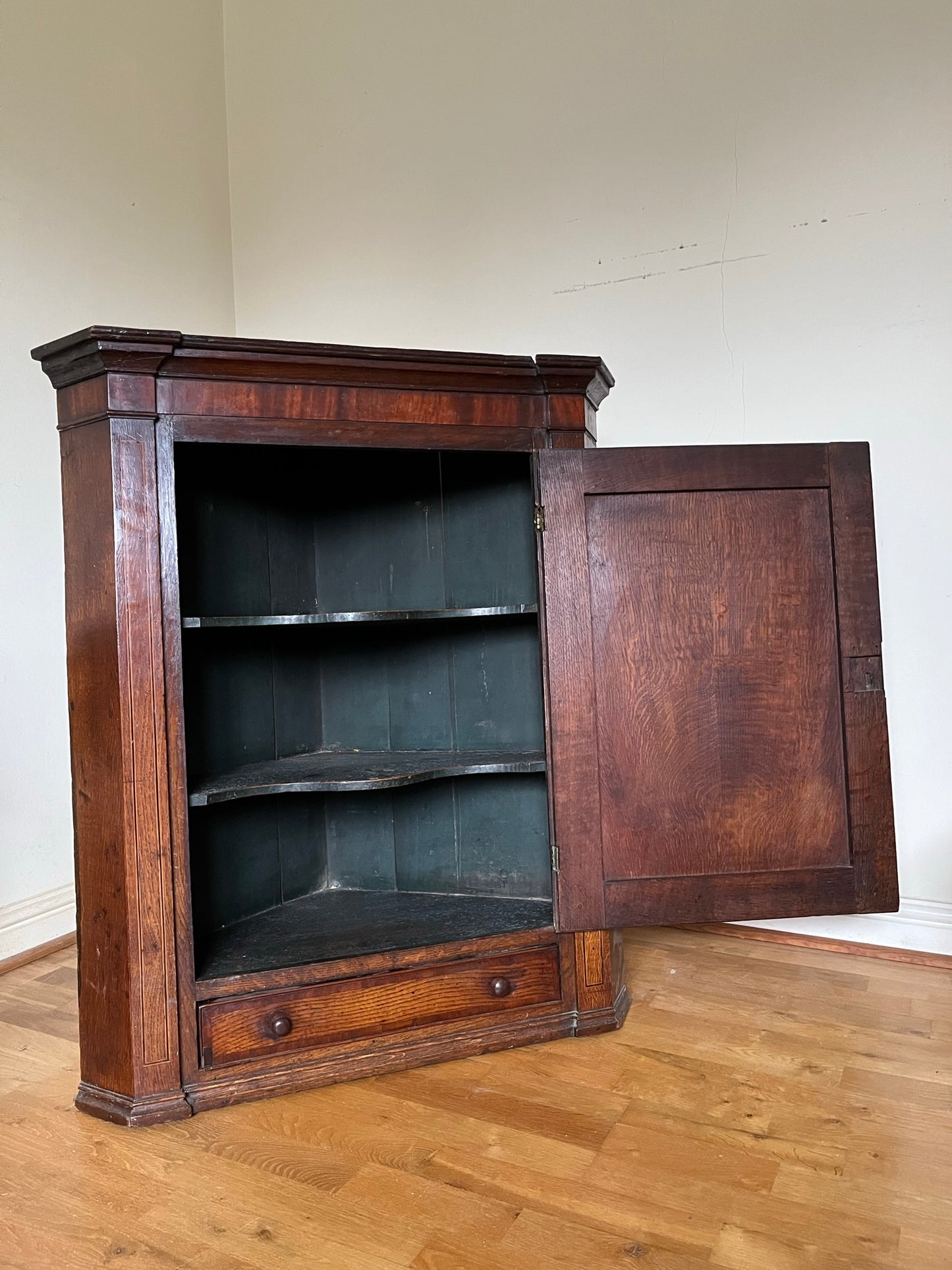 Georgian oak corner cupboard from country house, with provenance.