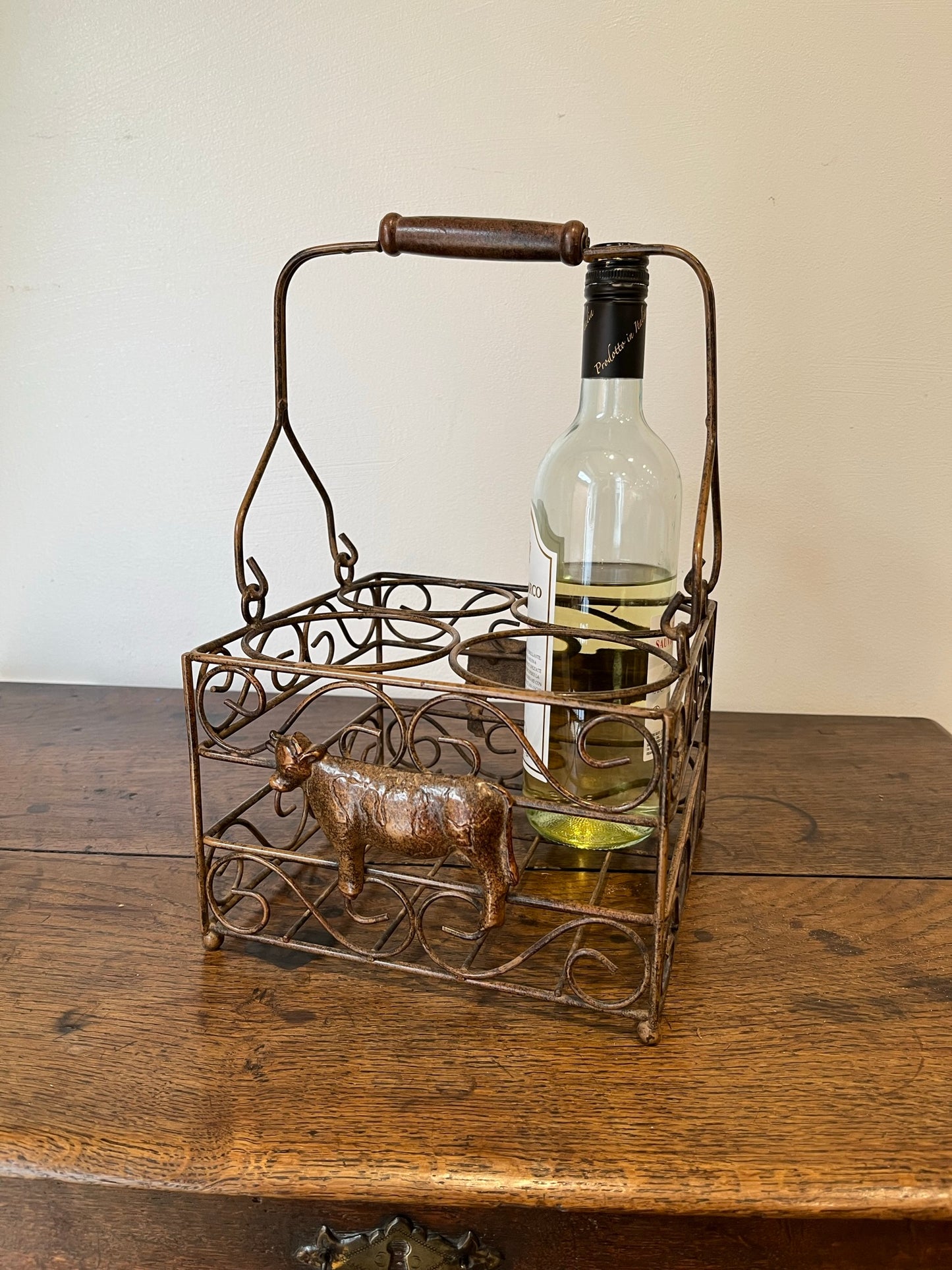 Pretty French milk bottle holder with cast cow detail.