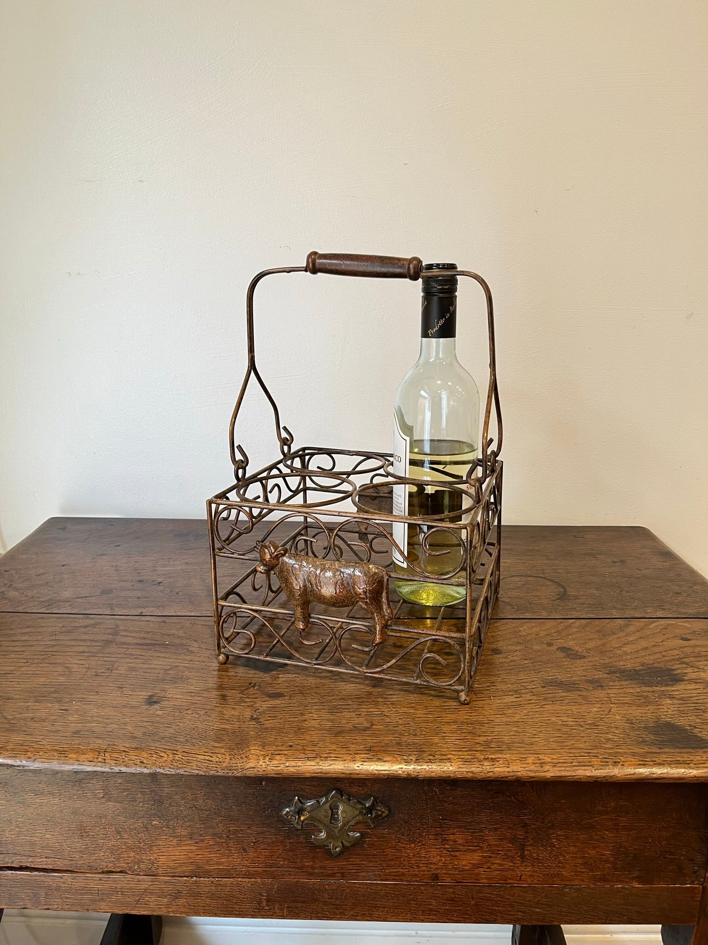 Pretty French milk bottle holder with cast cow detail.